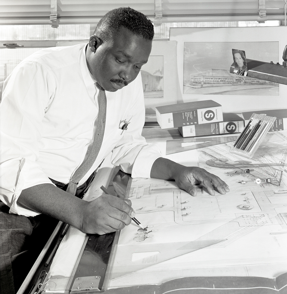 Man at drafting table.