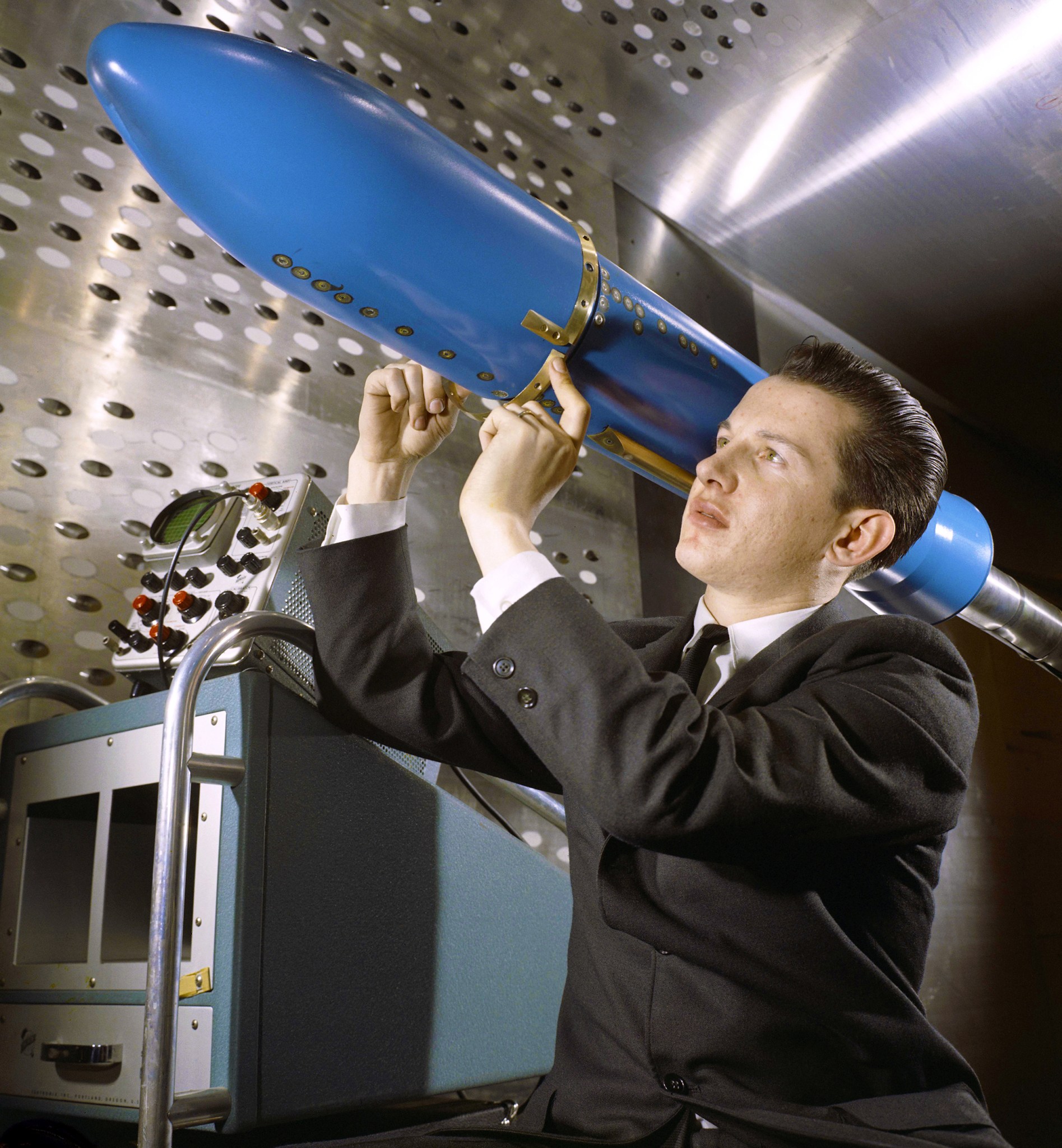Man with rocket model in test section.