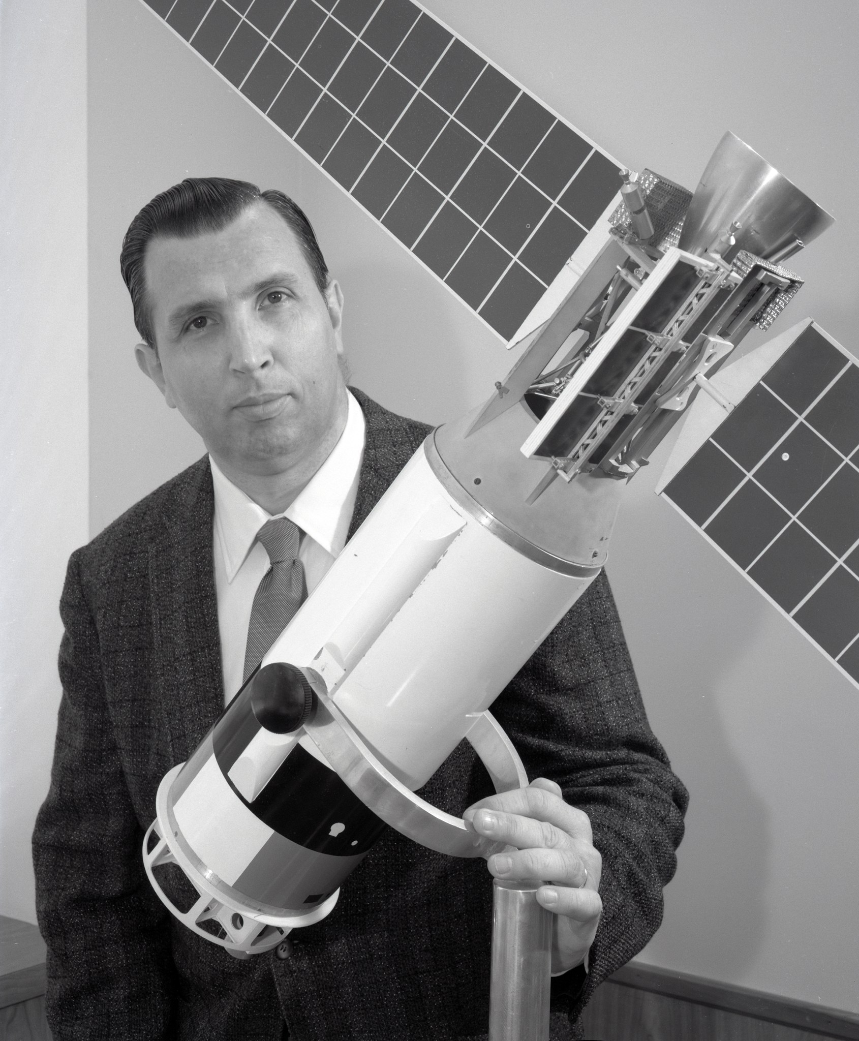 Man with spacecraft model.