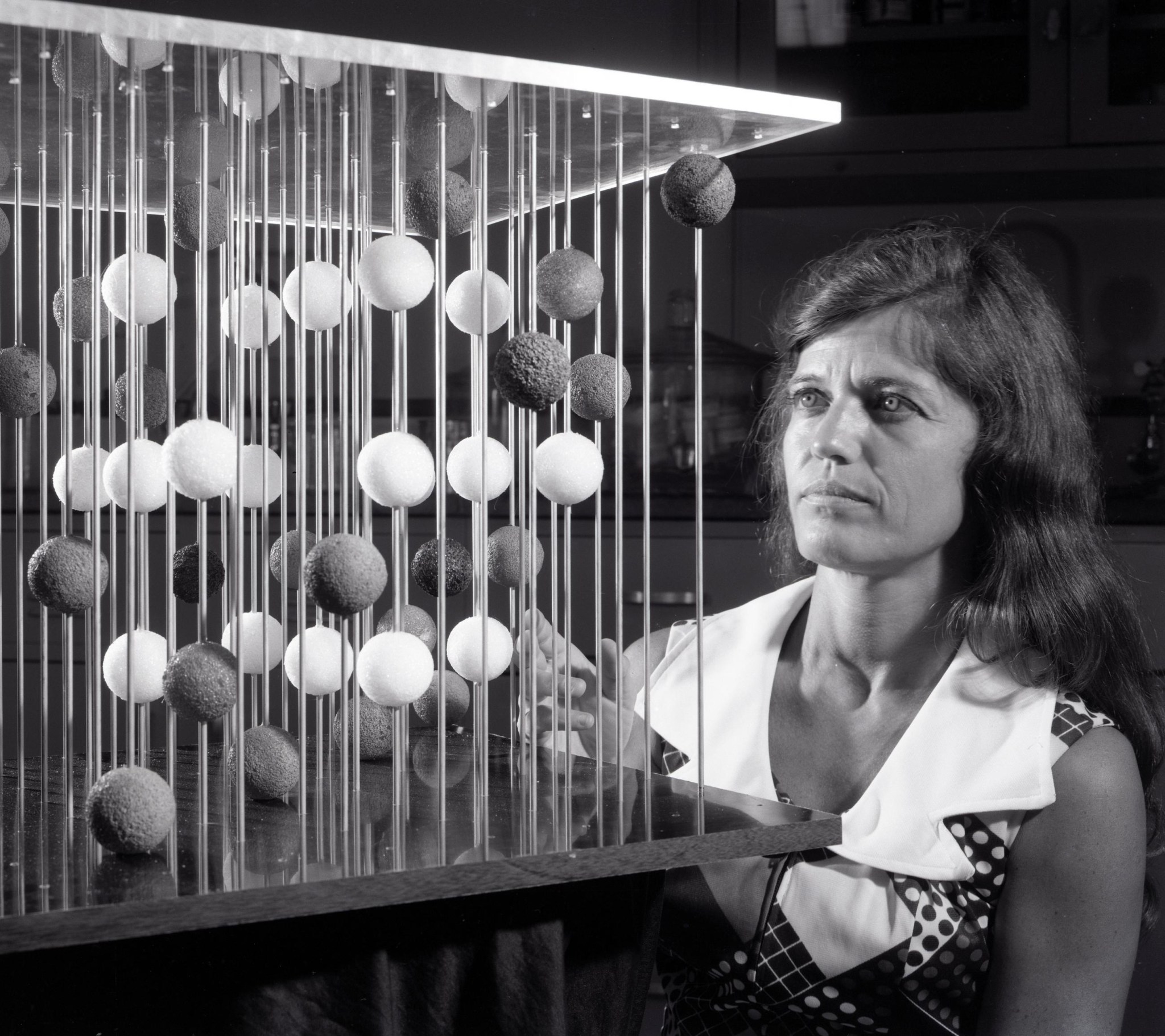 Woman looking at lab equipment.