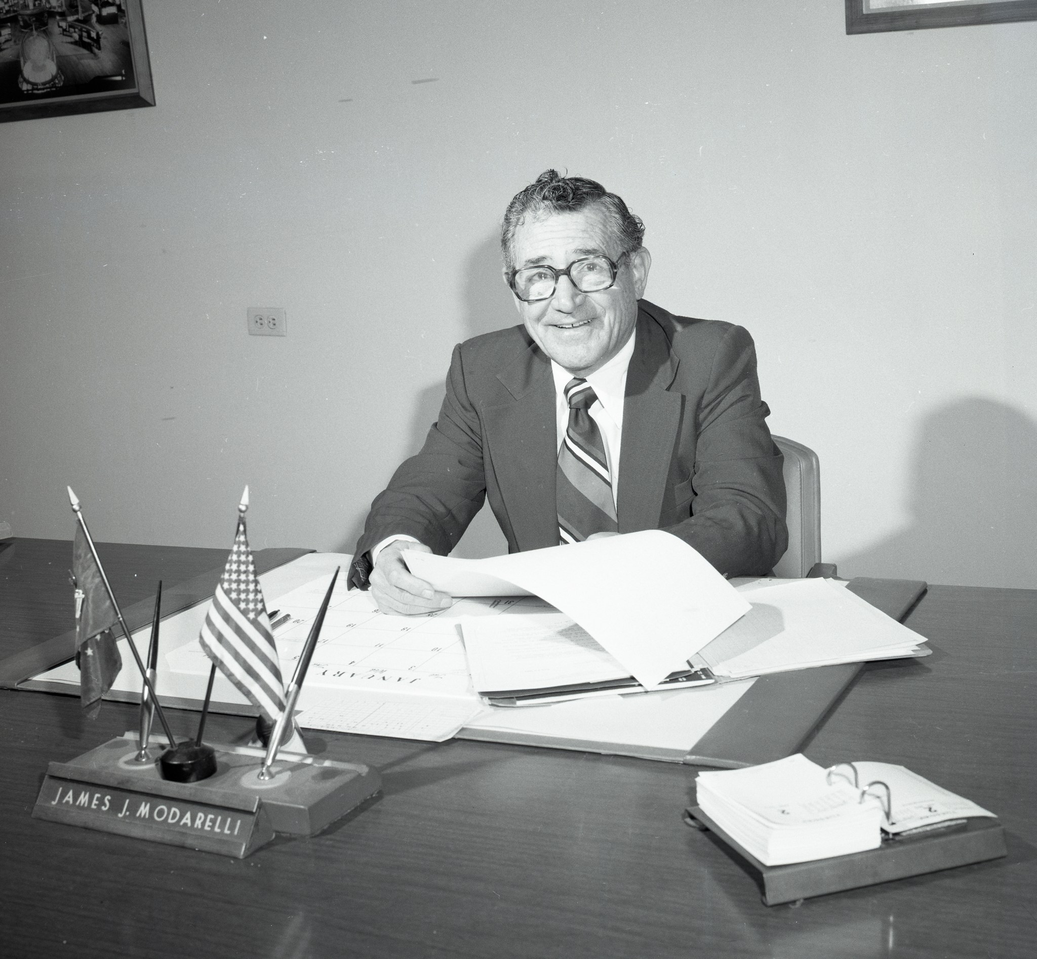 Man at desk in office.