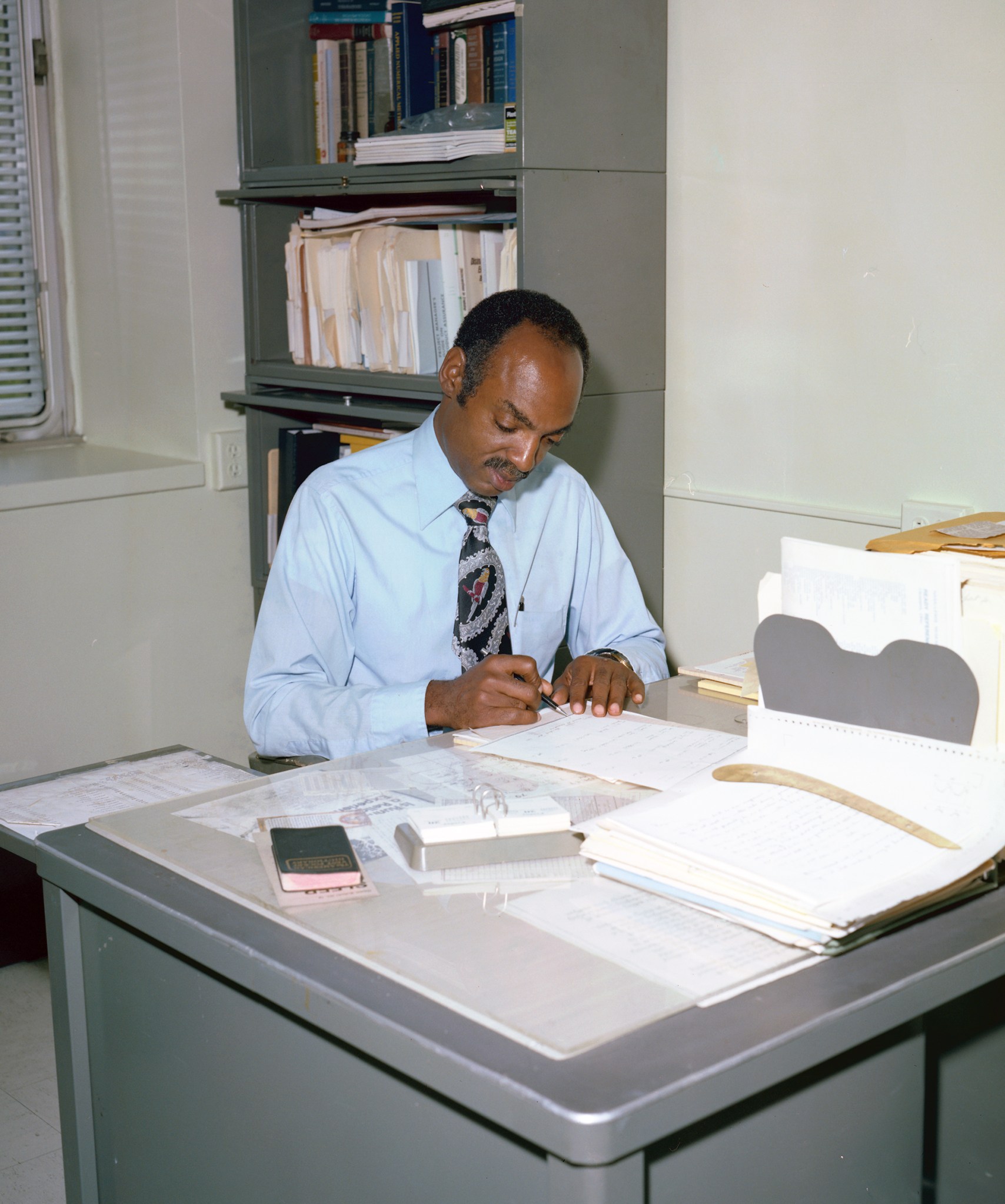 Man working at desk.