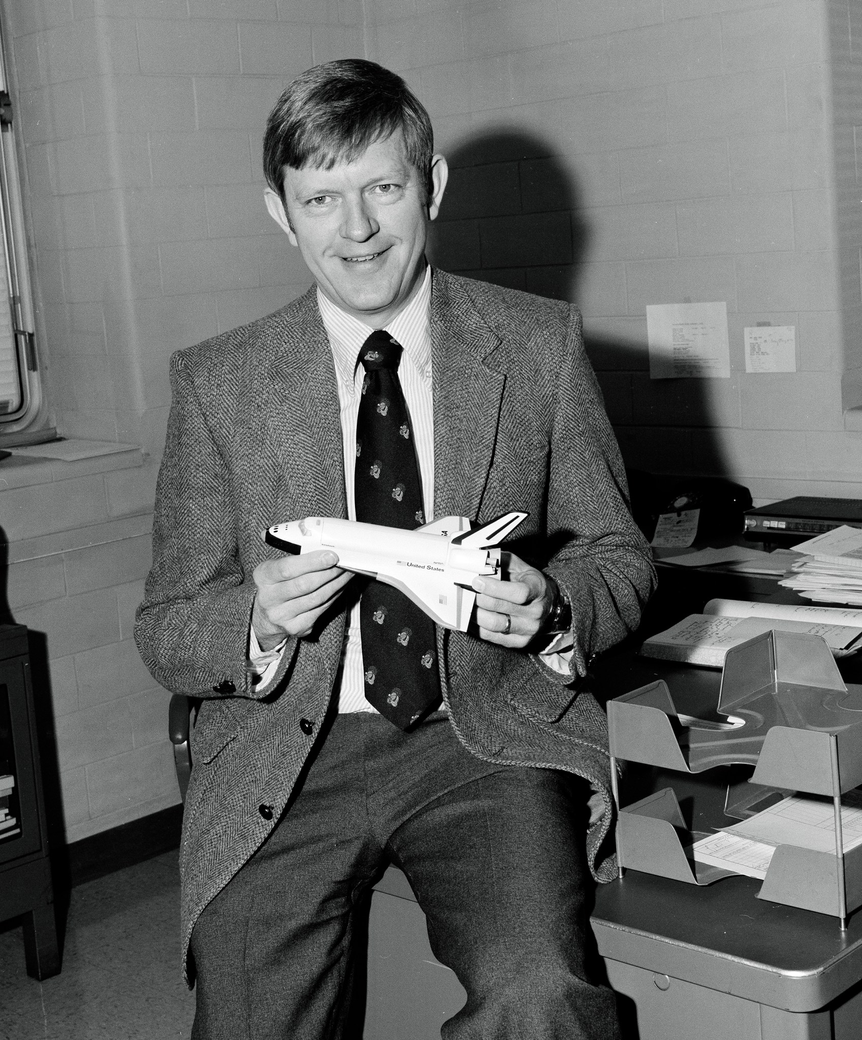 Man with space shuttle model.