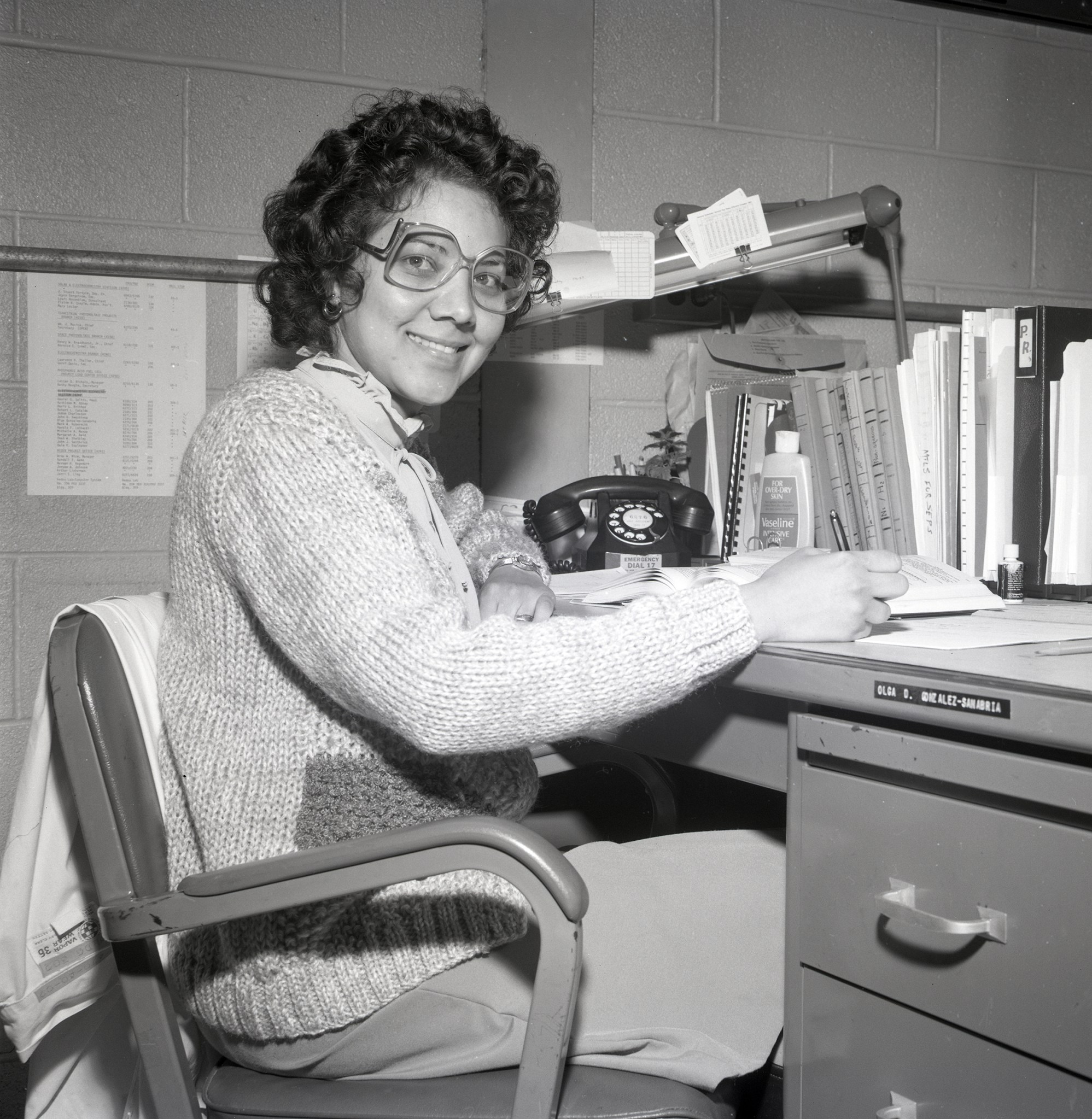 Woman sitting at desk.