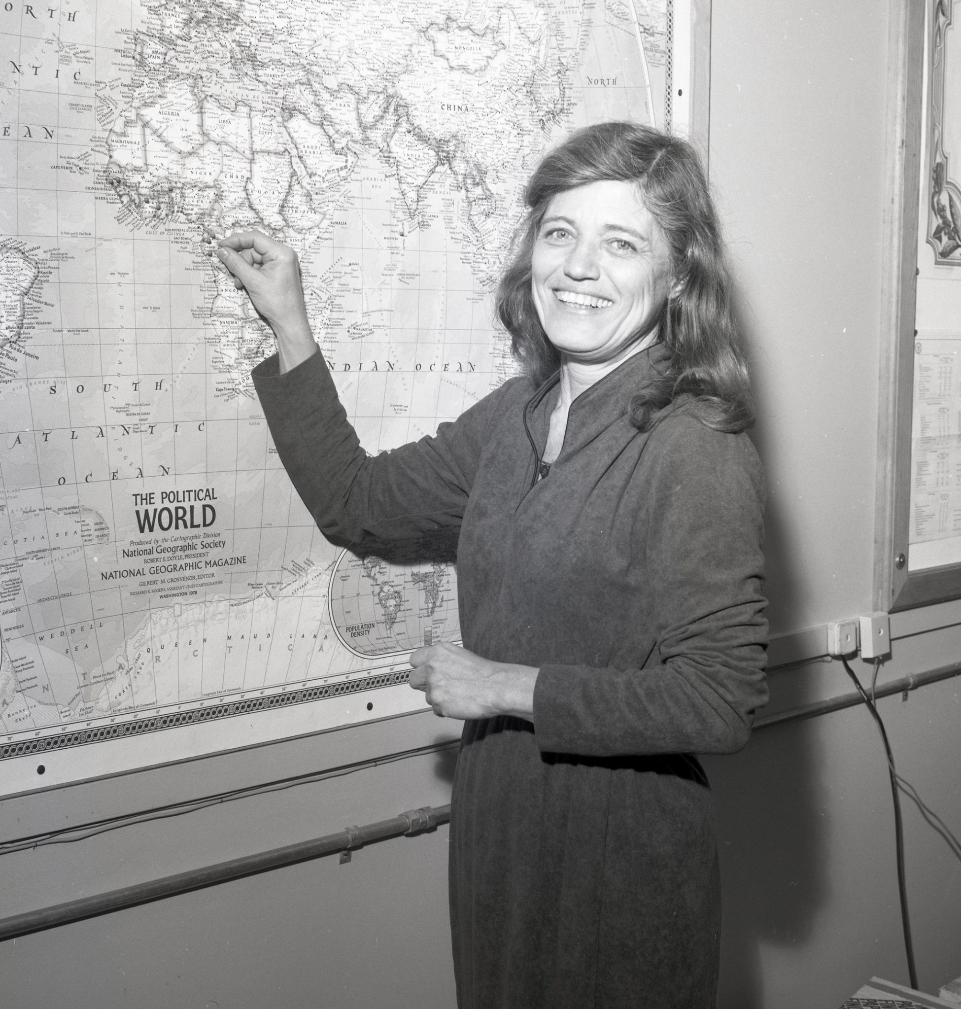 Woman pointing at map.