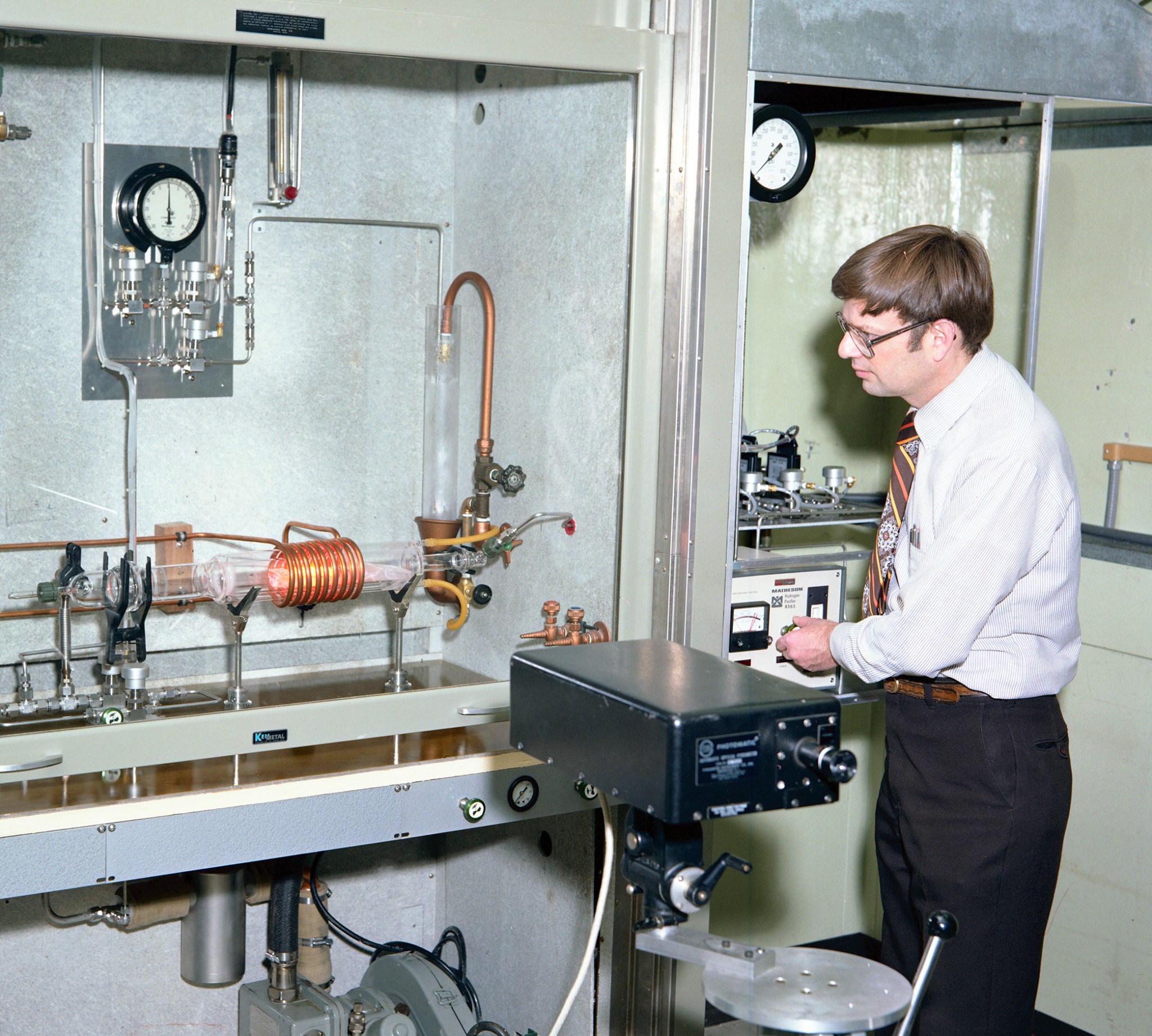 Man working with equipment in lab.