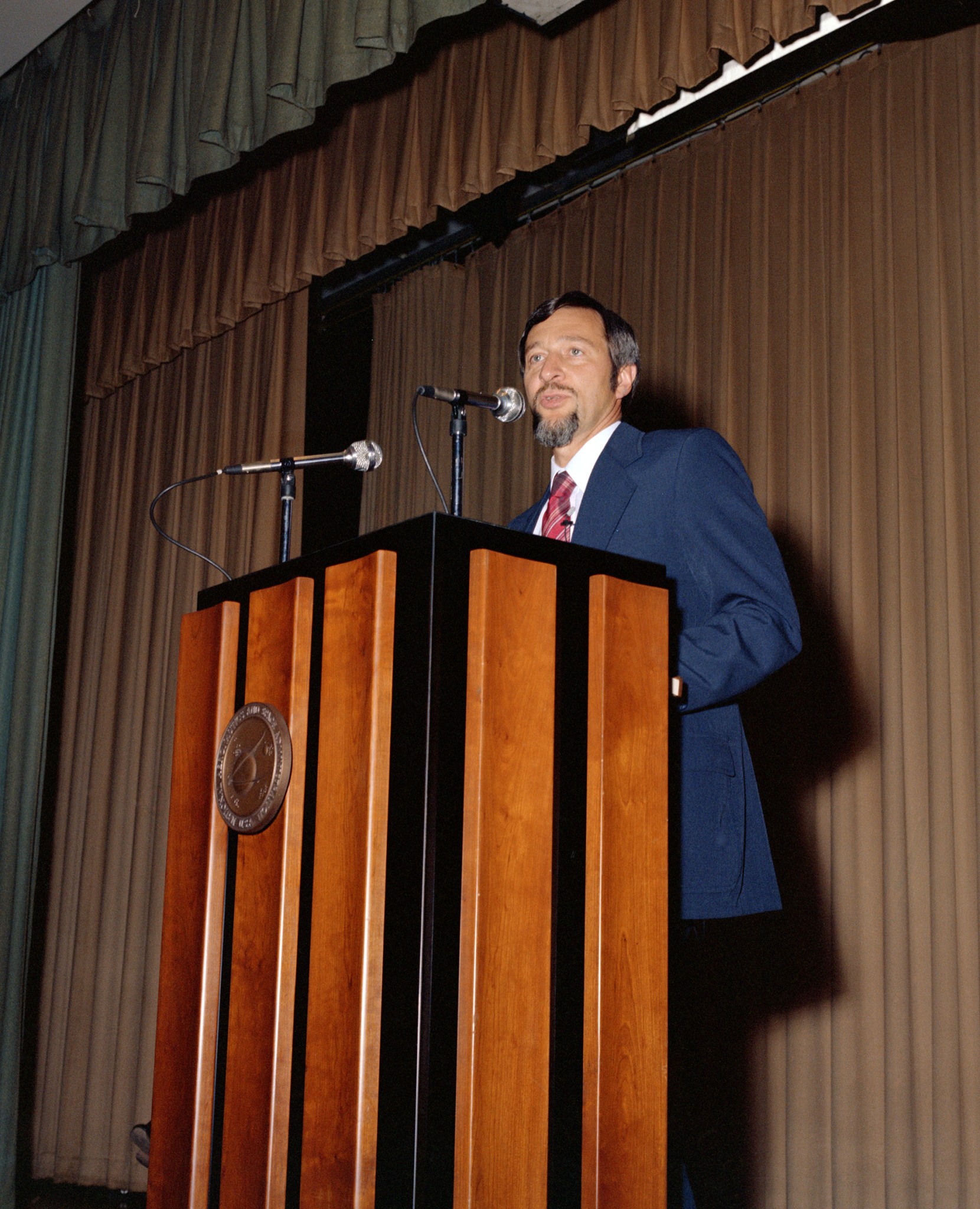 Man at podium.