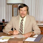 Andy Stofan at desk in office.