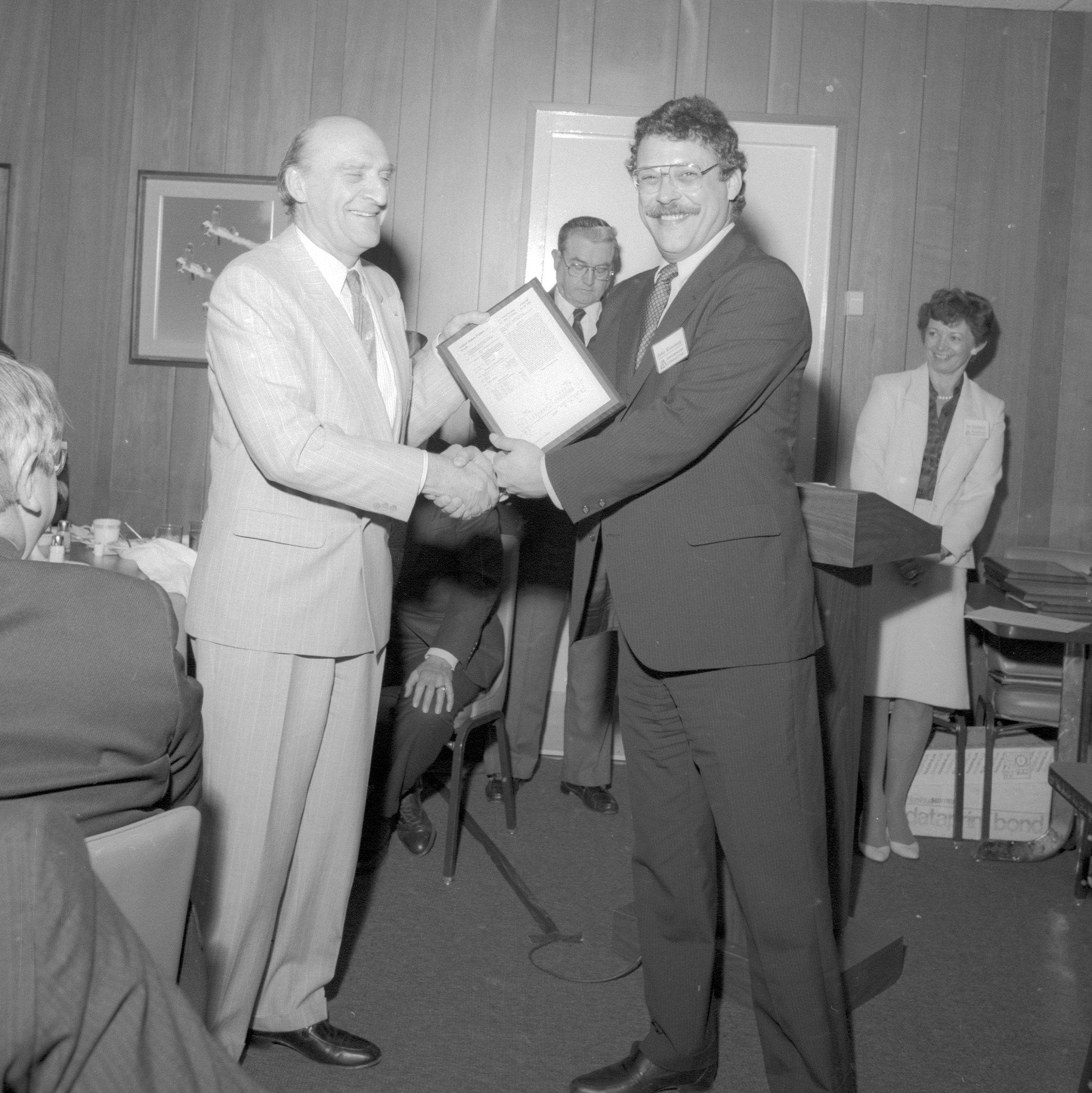 Two men shaking hands.