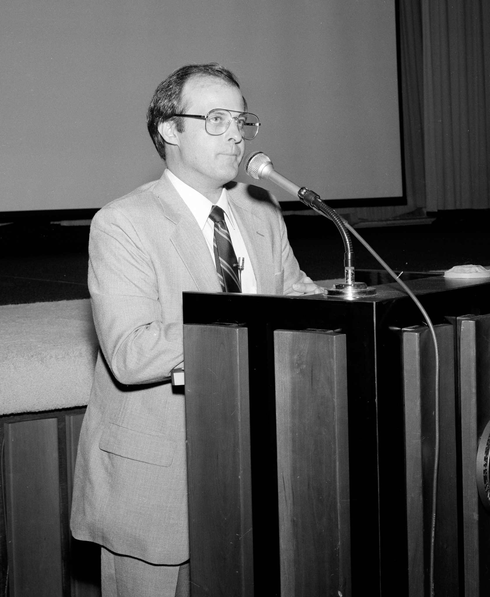 Man at podium.