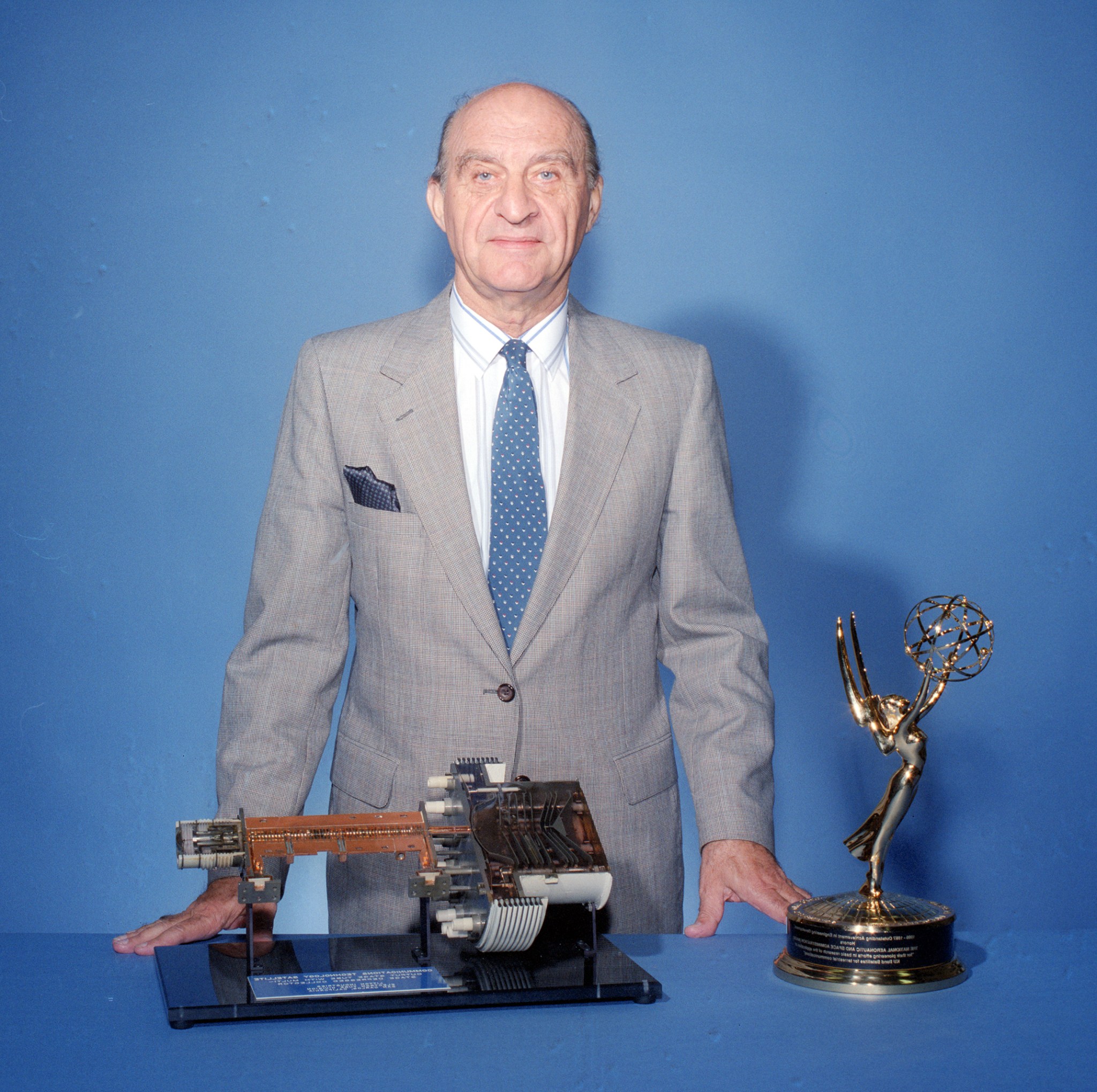 Man standing behind hardware.