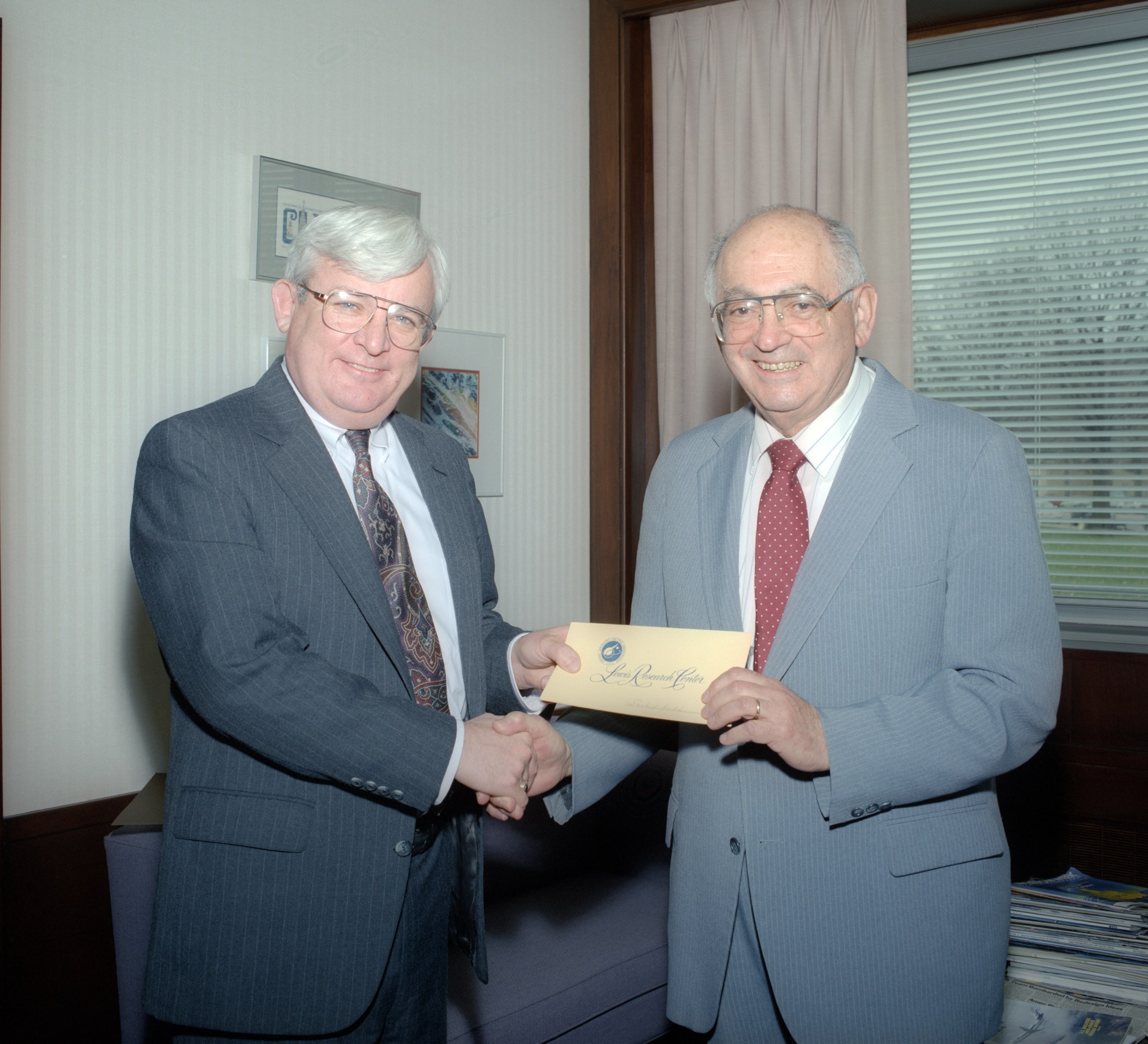 Two men shaking hands.