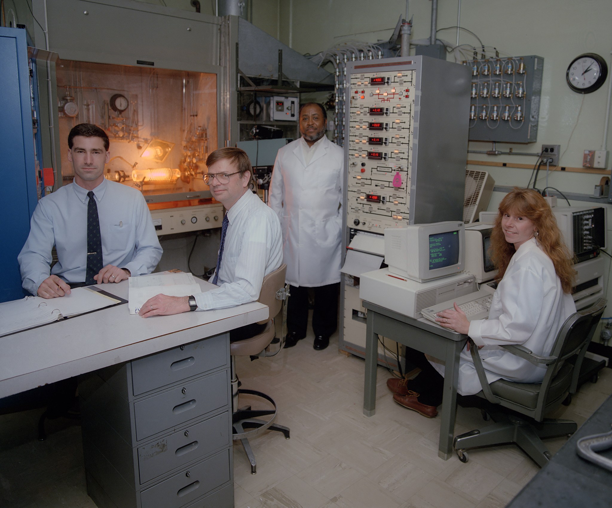 Four people in laboratory.