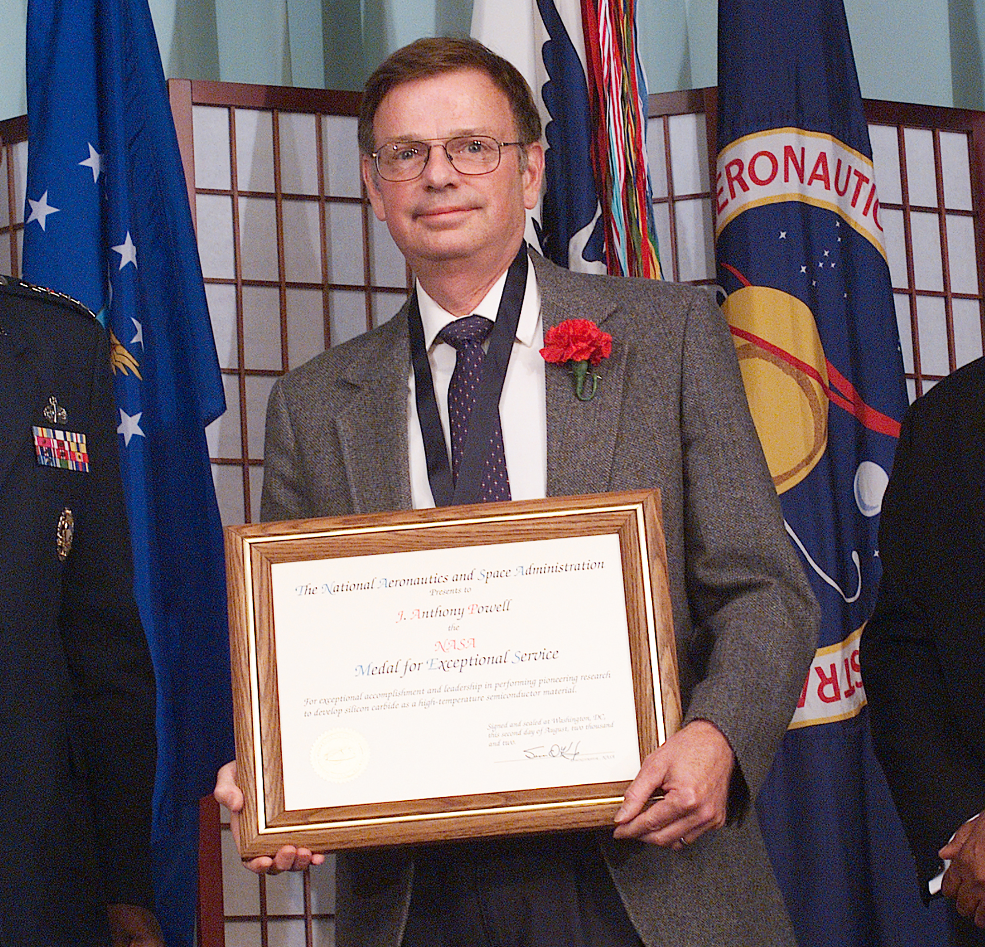 Man holding plaque.