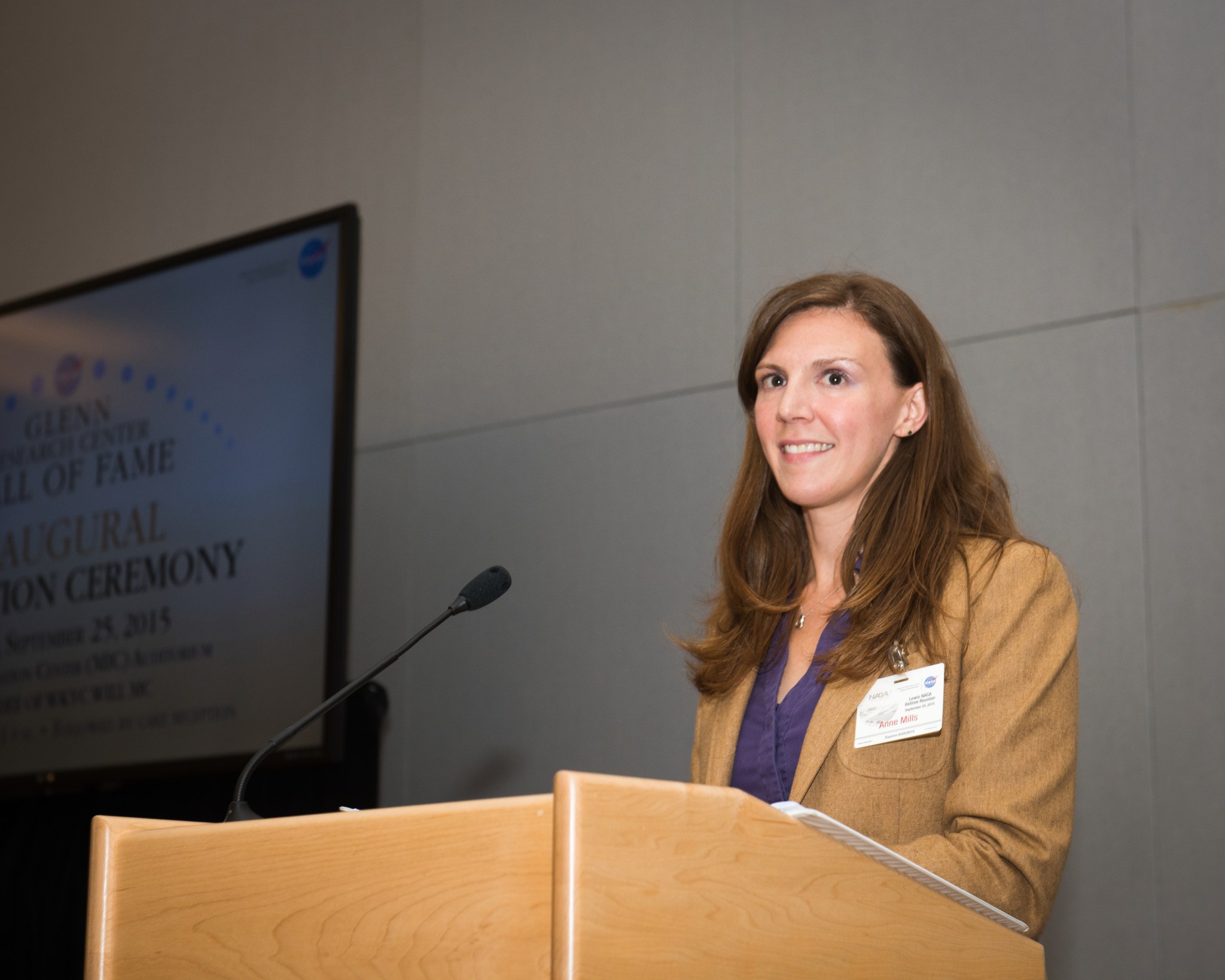 Woman at podium.