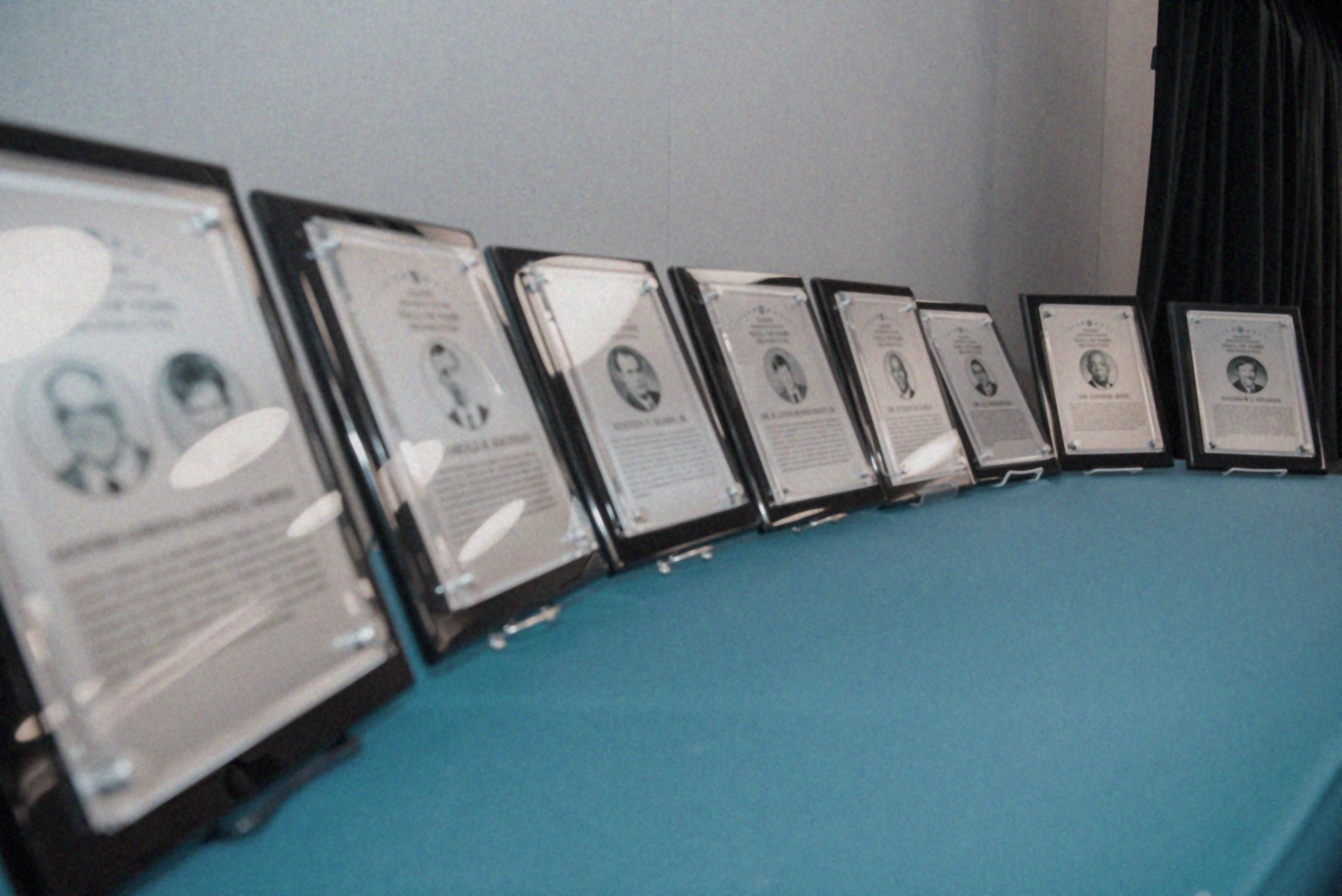 Hall of Fame plaques on table.