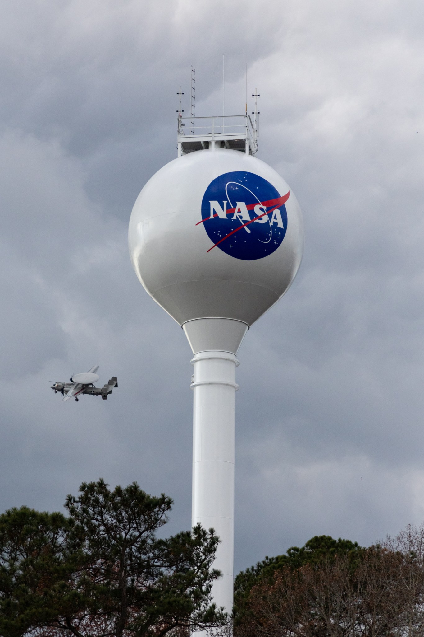 Elevated drinking water storage tank with painted NASA meatball logo