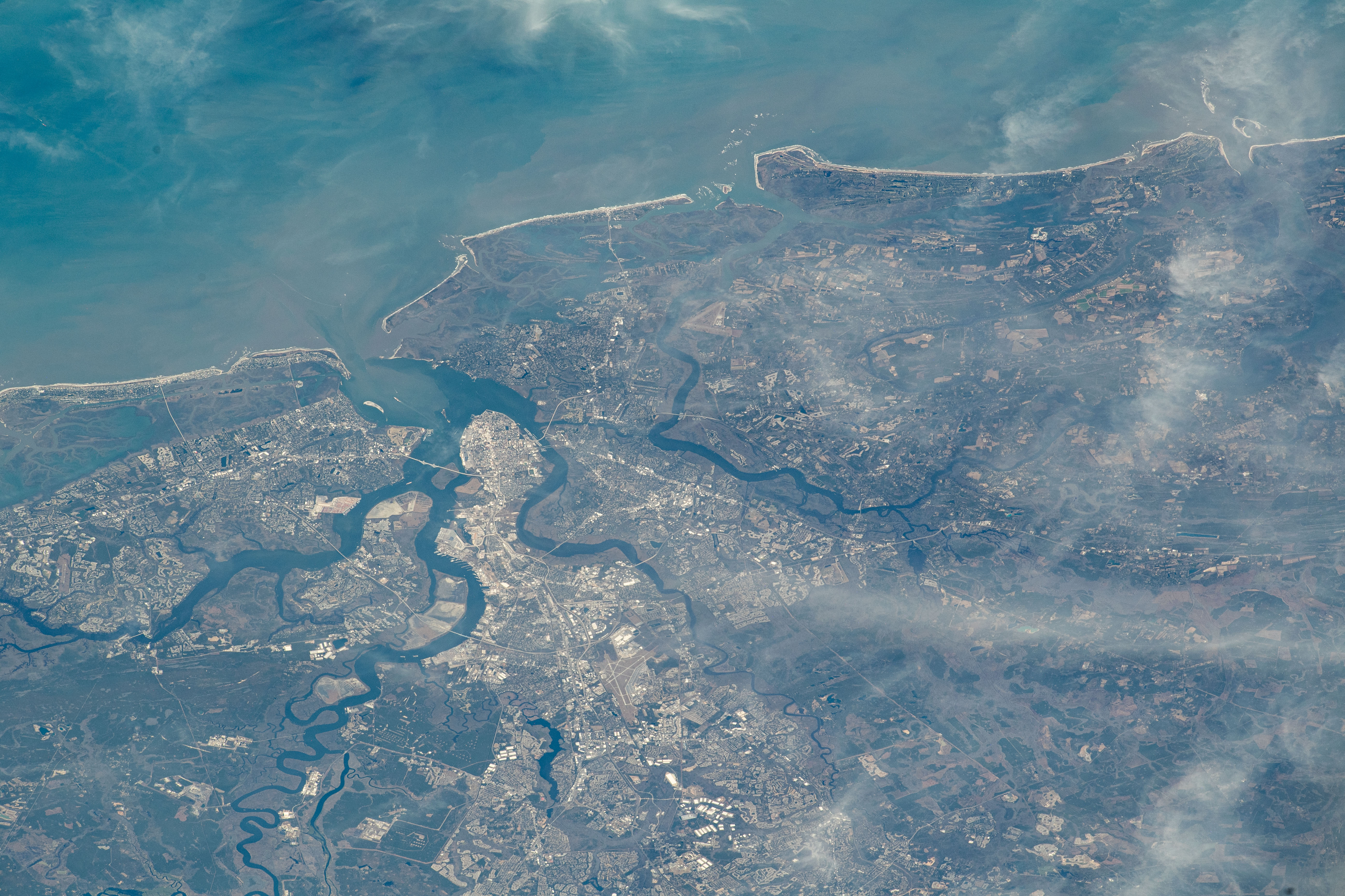 Charleston, South Carolina, and its sourrounding suburbs are split by rivers and creeks emptying into the Atlantic Ocean in this photograph from the International Space Station as it orbited 259 miles above.