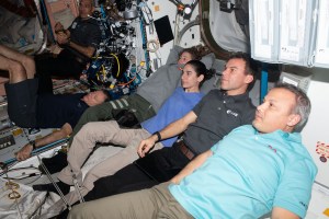 Members of the Axiom Mission 3 (Ax-3) and Expedition 70 crews join each other for movie night inside the International Space Station's Harmony module. From left are, Ax-3 Pilot Walter Villadei; Ax-3 Commander Michael López-Alegría; Expedition 70 Flight Engineers Loral O'Hara and Jasmin Moghbeli, both from NASA; and Ax-3 Mission Specialists Marcus Wandt and Alper Gezeravcı.