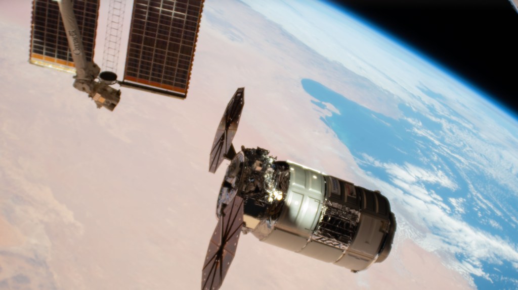 Northrop Grumman's Cygnus space freighter, packed with more than 8,200 pounds of science experiments, crew supplies, and station hardware, arrives at its capture point for installation to the International Space Station's Unity module. Both spacecraft were orbiting 260 miles above the Libya at the time of this photograph.