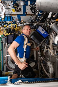 ESA (European Space Agency) astronaut and Expedition 70 Commander Andreas Mogensen jogs while strapped to a treadmill inide the International Space Station's Tranquility module.