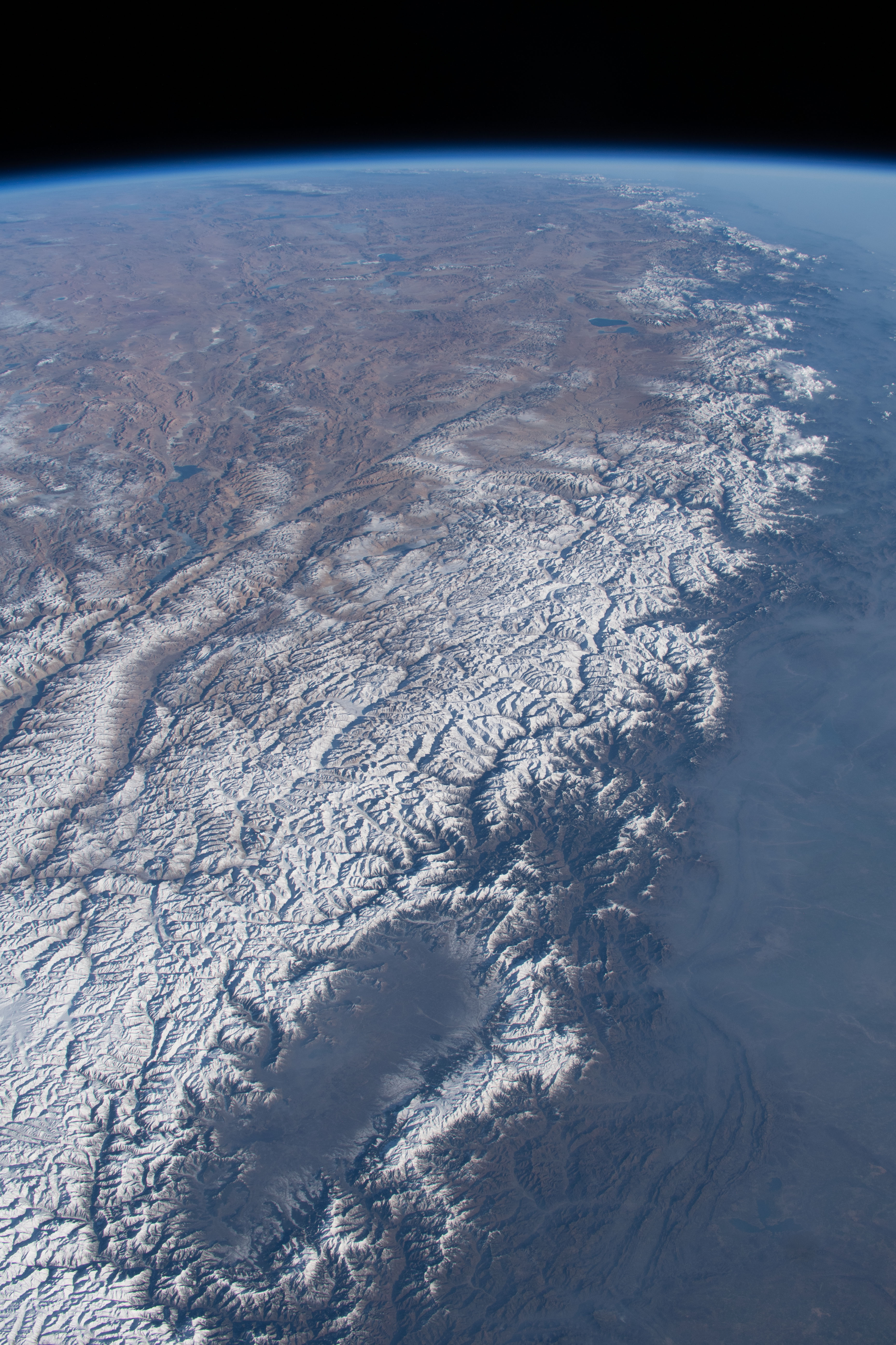 The Kashmir Valley (bottom) and the Himalayas are pictured from the International Space Station as it orbited 261 miles above the Afghanistan-Pakistan border.