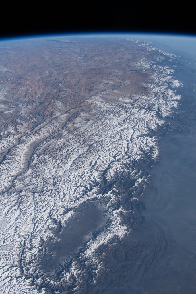 The Kashmir Valley (bottom) and the Himalayas are pictured from the International Space Station as it orbited 261 miles above the Afghanistan-Pakistan border.