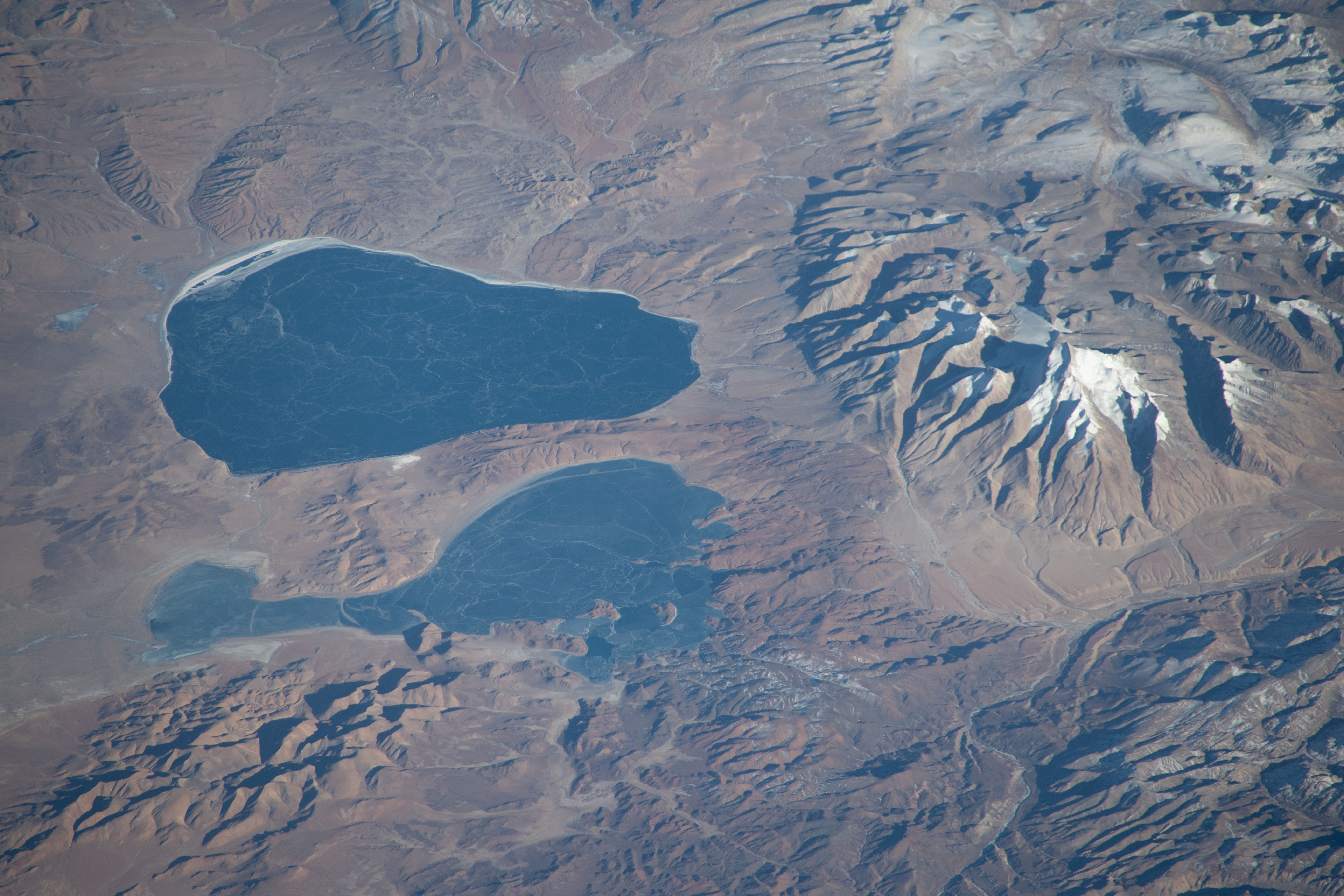 Lakes Mansarovar (top) and Rakshastal, on the Chinese side of the Himalayan border with India, are pictured from the International Space Station as it orbited 260 miles above the Indian subcontinent.