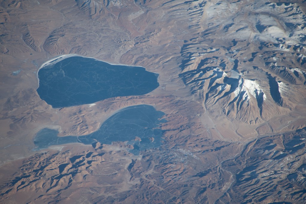 Lakes Mansarovar (top) and Rakshastal, on the Chinese side of the Himalayan border with India, are pictured from the International Space Station as it orbited 260 miles above the Indian subcontinent.