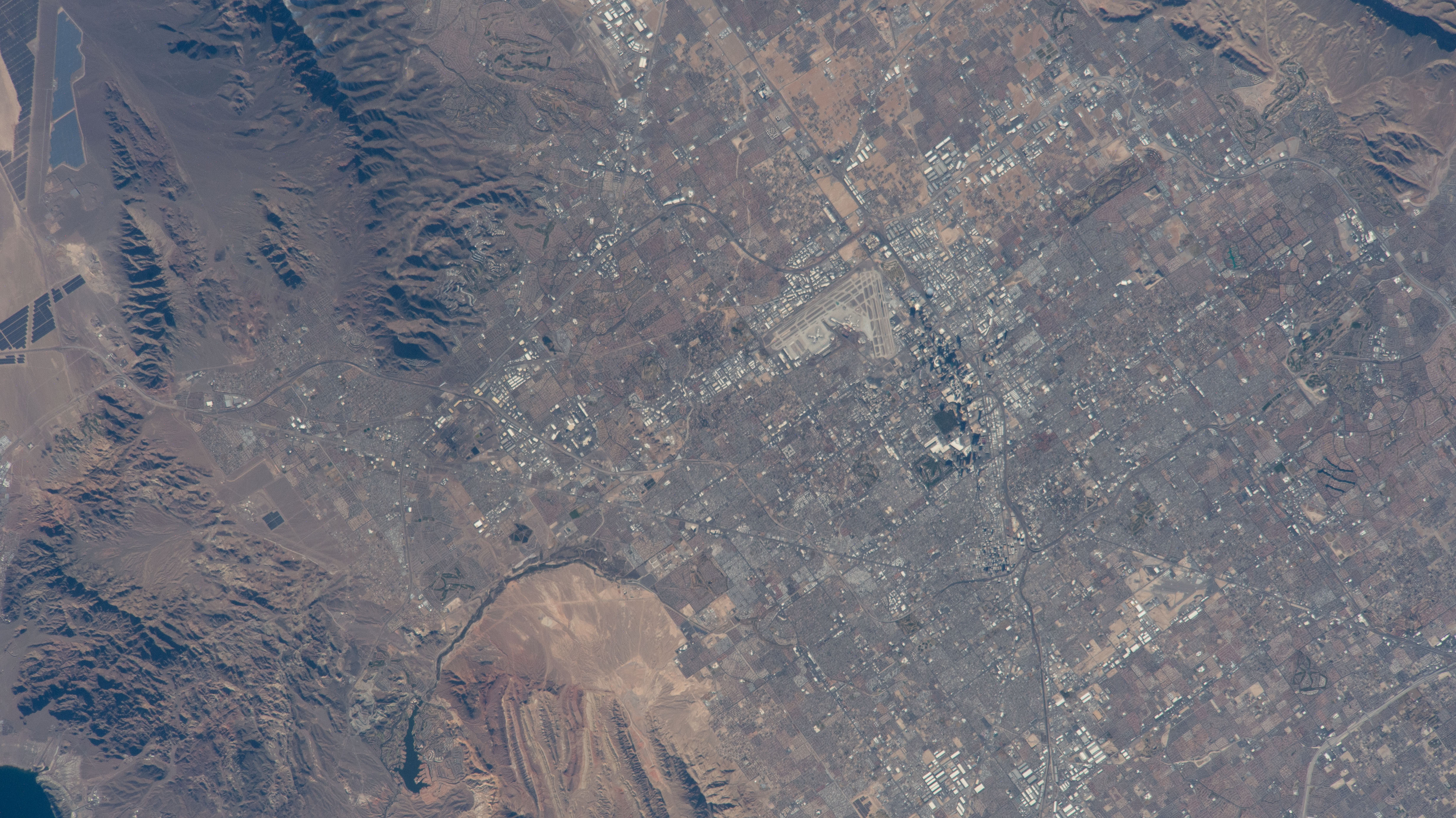 The International Space Station was soaring 261 miles above Las Vegas at the time of this photograph minutes before kickoff at Super Bowl LVIII on Feb. 11, 2024. Landmarks pictured from an external station camera are, Allegiant Stadium, The Sphere (partially obscured by shadow), and Harry Reid International Airport.