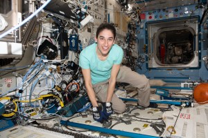 NASA astronaut and Expedition 70 Flight Engineer Jasmin Moghbeli is pictured inside the International Space Station's Destiny laboratory module opening a science freezer that hosts research samples for preservation and analysis.