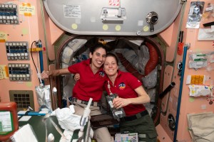 Expedition 70 Flight Engineers (from left) Jasmin Moghbeli and Loral O'Hara, both from NASA, pose together for a portrait inside the International Space Station's Unity module.