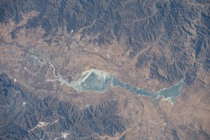 The Guanting Reservoir, northwest of Beijing, China, and surrounded by several smaller cities, is pictured from the International Space Station as it orbited 262 miles above.