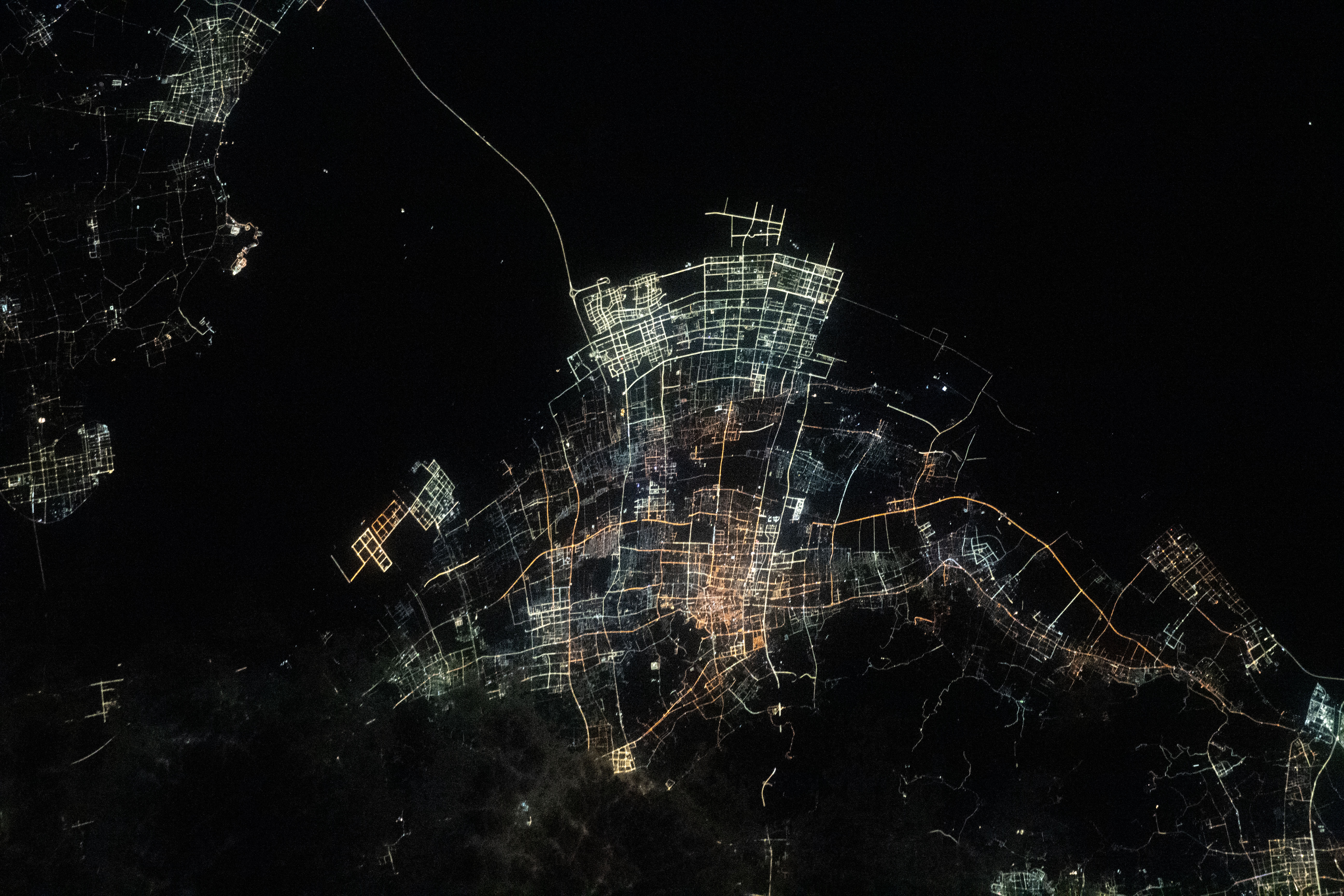 The night lights of Chinese villlages on Hangzhou Bay are pictured from the International Space Station as it orbited 260 miles above the East China Sea.