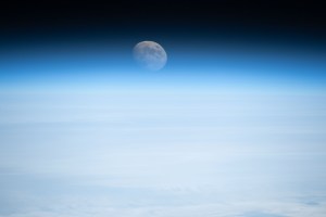 Earth's atmosphere refracts the light of the waxing gibbous Moon in this photograph from the International Space Station as it orbited 261 miles above the Atlantic Ocean off the coast of the northeastern United States.