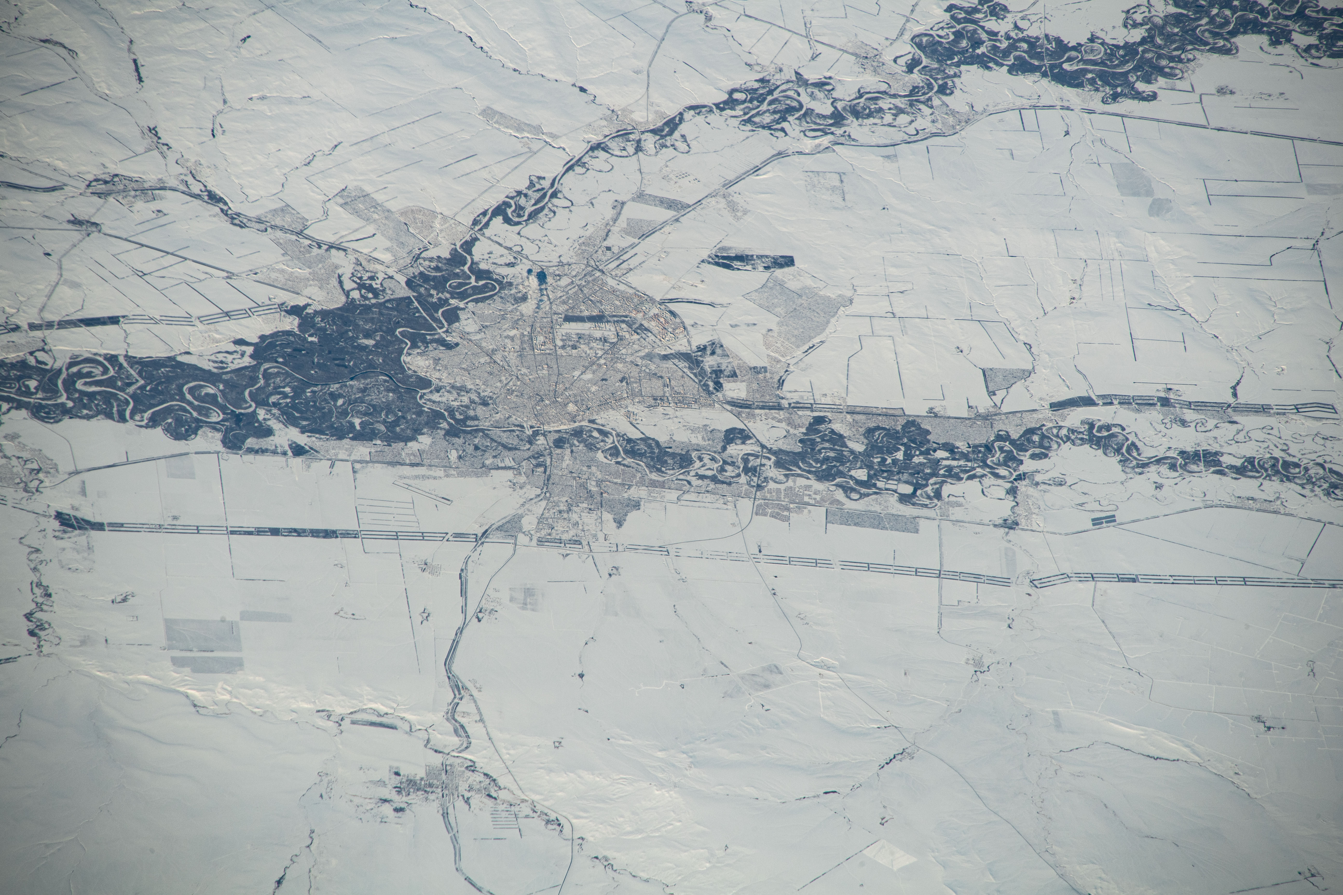 Orenburg, Russia, surrounded by a wintry landscape, the Sakmara and Ural Rivers, and near the border with Kazakhstan, is pictured from the International Station as it orbited 263 miles above the area where Eastern Europe meets central Asia.