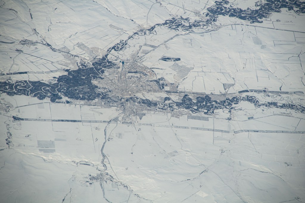 Orenburg, Russia, surrounded by a wintry landscape, the Sakmara and Ural Rivers, and near the border with Kazakhstan, is pictured from the International Station as it orbited 263 miles above the area where Eastern Europe meets central Asia.