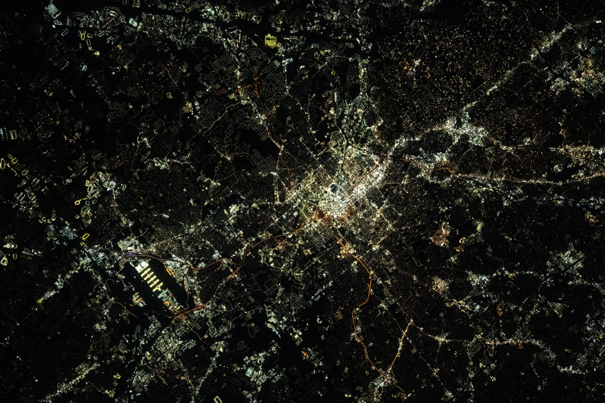 Atlanta, Georgia, and Hartsfield-Jackson Atlanta International Airport (lower left) are pictured during nighttime from the International Space Station as it orbited 260 miles above the Peach State.
