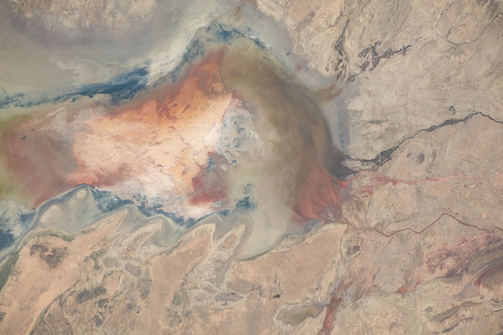 Poopó Lake in Bolivia. a mostly dried up saline lake due to a variety of reasons including mining and agricultural activities, is pictured from the International Space Station as it orbited 261 miles above the South American continent.
