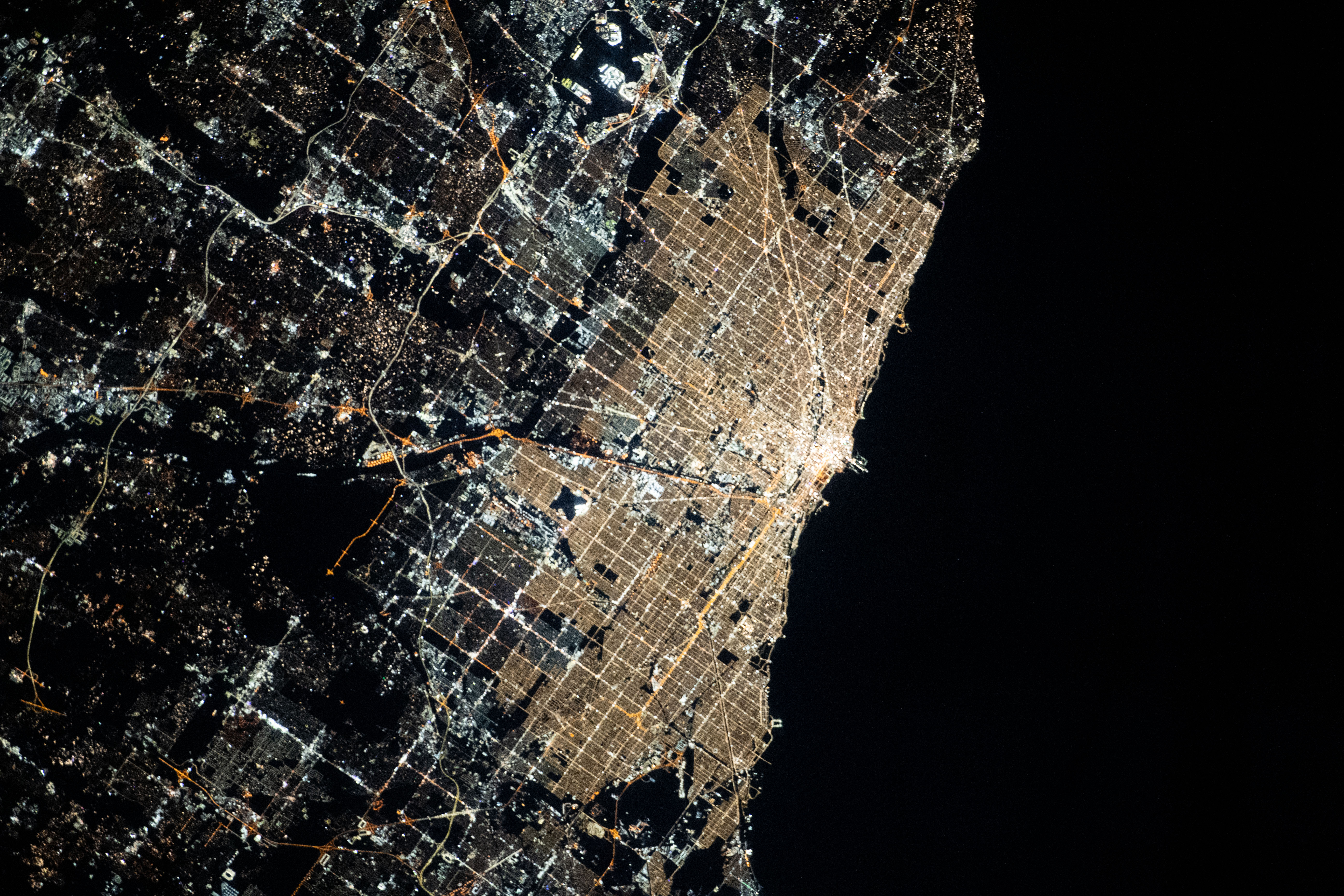 Chicago, Illinois, was pictured at night by Expedition 70 Flight Engineer Jasmin Moghbeli as the International Space Station orbited 261 miles above Lake Michigan.