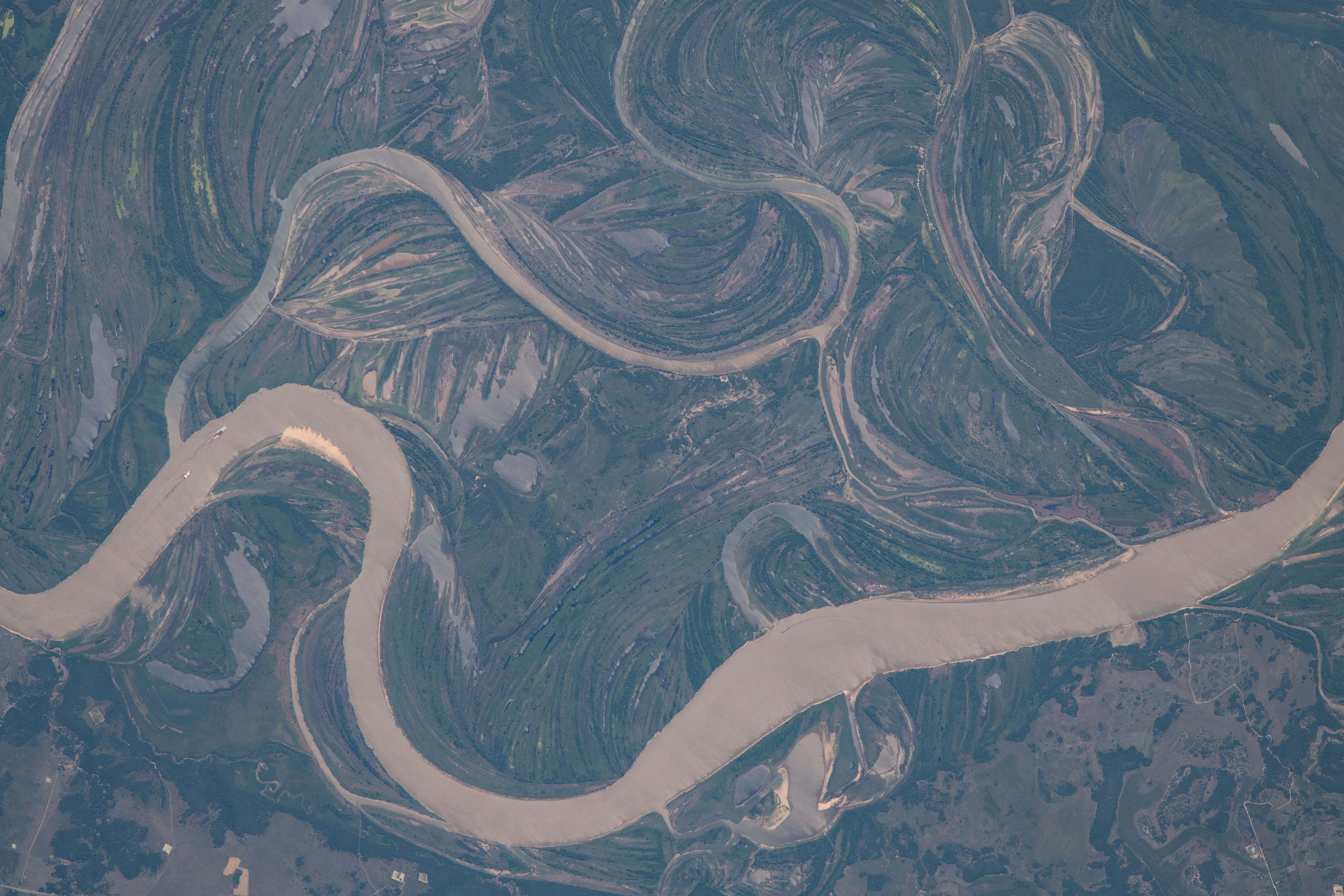 The Paraguay River, separating the nations of Argentina and Paraguay in this photograph, and its tributaries were pictured by Expedition 70 Flight Engineer Jasmin Moghbeli as the International Space Station orbited 263 miles above.