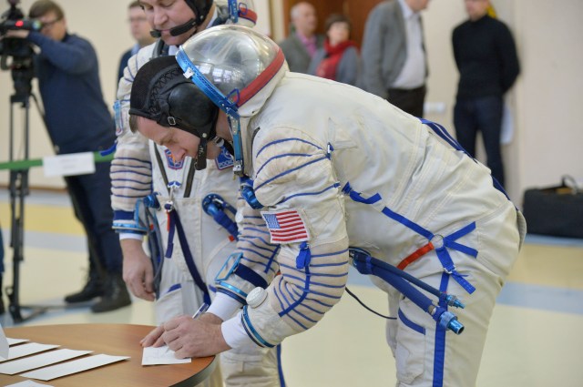 At the Gagarin Cosmonaut Training Center in Star City, Russia, Expedition 55 backup crew member Nick Hague of NASA signs in for qualification exams Feb. 20. Hague and Alexey Ovchinin of Roscosmos are serving as backups to the prime crew, Oleg Artemyev of Roscosmos and Ricky Arnold and Drew Feustel of NASA, who will launch March 21 on the Soyuz MS-08 spacecraft from the Baikonur Cosmodrome in Kazakhstan for a five month mission on the International Space Station.