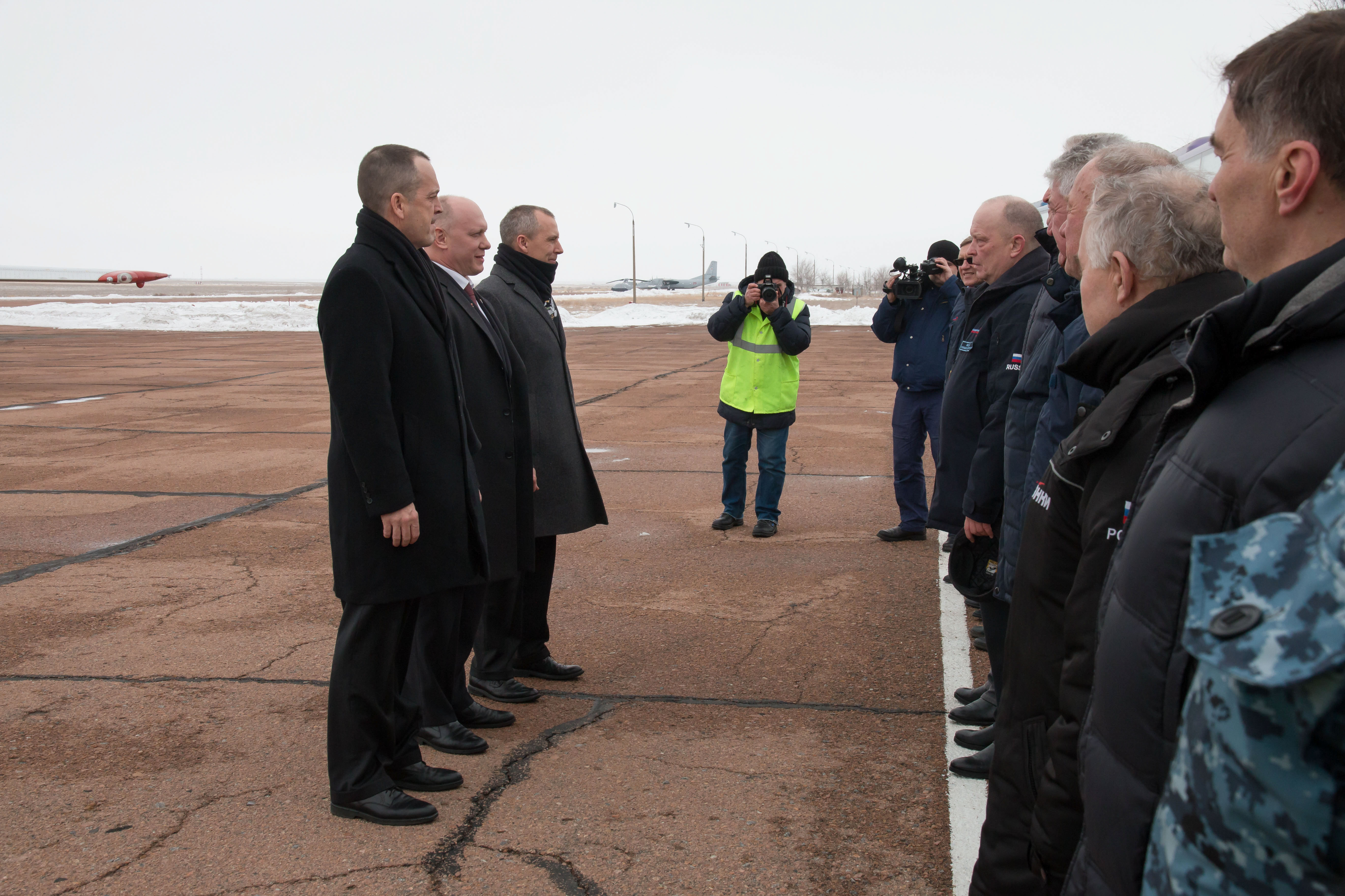 Expedition 55 crewmembers Ricky Arnold of NASA, Oleg Artemyev of Roscosmos and Drew Feustel of NASA are greeted by Russian space officials in Baikonur, Kazakhstan after their arrival March 4 following a flight from their training base outside of Moscow. The trio will launch March 21 on the Soyuz MS-08 spacecraft for a five month mission on the International Space Station.