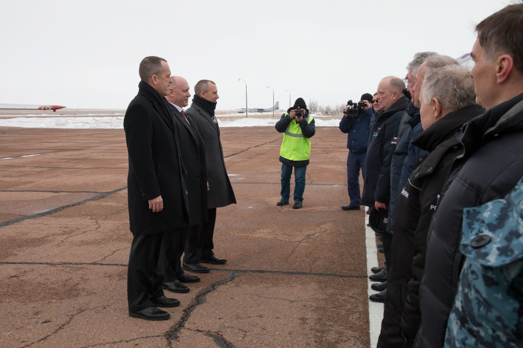 Expedition 55 crewmembers Ricky Arnold of NASA, Oleg Artemyev of Roscosmos and Drew Feustel of NASA are greeted by Russian space officials in Baikonur, Kazakhstan after their arrival March 4 following a flight from their training base outside of Moscow. The trio will launch March 21 on the Soyuz MS-08 spacecraft for a five month mission on the International Space Station.