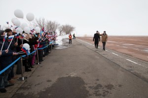 Expedition 55 backup crewmembers Nick Hague of NASA and Alexey Ovchinin of Roscosmos wave to local school children after arriving at the airstrip in Baikonur, Kazakhstan March 4 following a flight from their training base outside of Moscow. They are serving as backups to Ricky Arnold and Drew Feustel of NASA and Oleg Artemyev of Roscosmos, who will launch March 21 on the Soyuz MS-08 spacecraft for a five month mission on the International Space Station.
