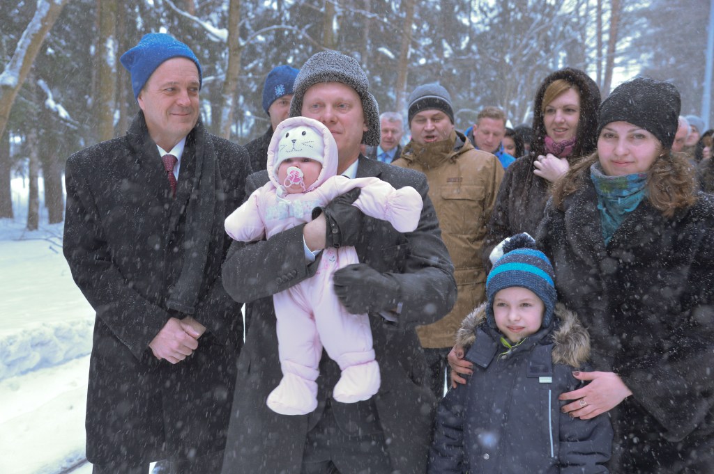 Bundled up against a blizzard, Expedition 55 crewmember Oleg Artemyev of Roscosmos holds his infant child March 4 at the Gagarin Cosmonaut Training Center in Star City, Russia as he and his family walk to a waiting bus to take them to a nearby airport for a flight to the launch site at the Baikonur Cosmodrome in Kazakhstan. Looking on is crewmate Ricky Arnold of NASA (left). Arnold, Artemyev and Drew Feustel of NASA will launch March 21 on the Soyuz MS-08 spacecraft for a five month mission on the International Space Station.