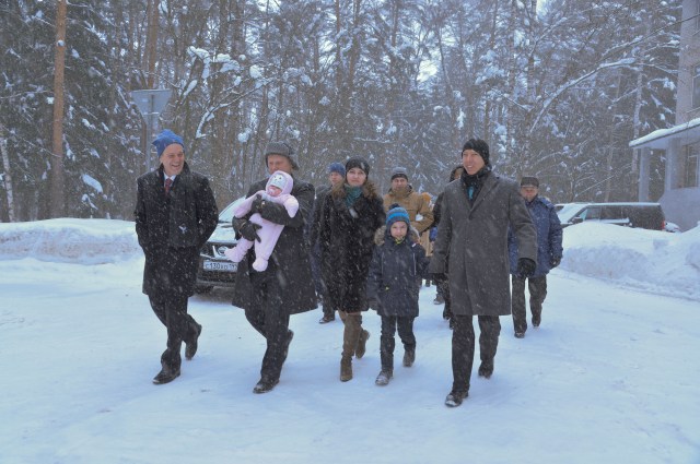 Bundled up against a blizzard, Expedition 55 crewmember Oleg Artemyev of Roscosmos (center) holds his infant child March 4 at the Gagarin Cosmonaut Training Center in Star City, Russia as he and his crewmates walk to a waiting bus to take them to a nearby airport for a flight to the launch site at the Baikonur Cosmodrome in Kazakhstan. Looking on are crewmates Ricky Arnold of NASA (left) and Drew Feustel of NASA (right). The trio will launch March 21 on the Soyuz MS-08 spacecraft for a five month mission on the International Space Station.