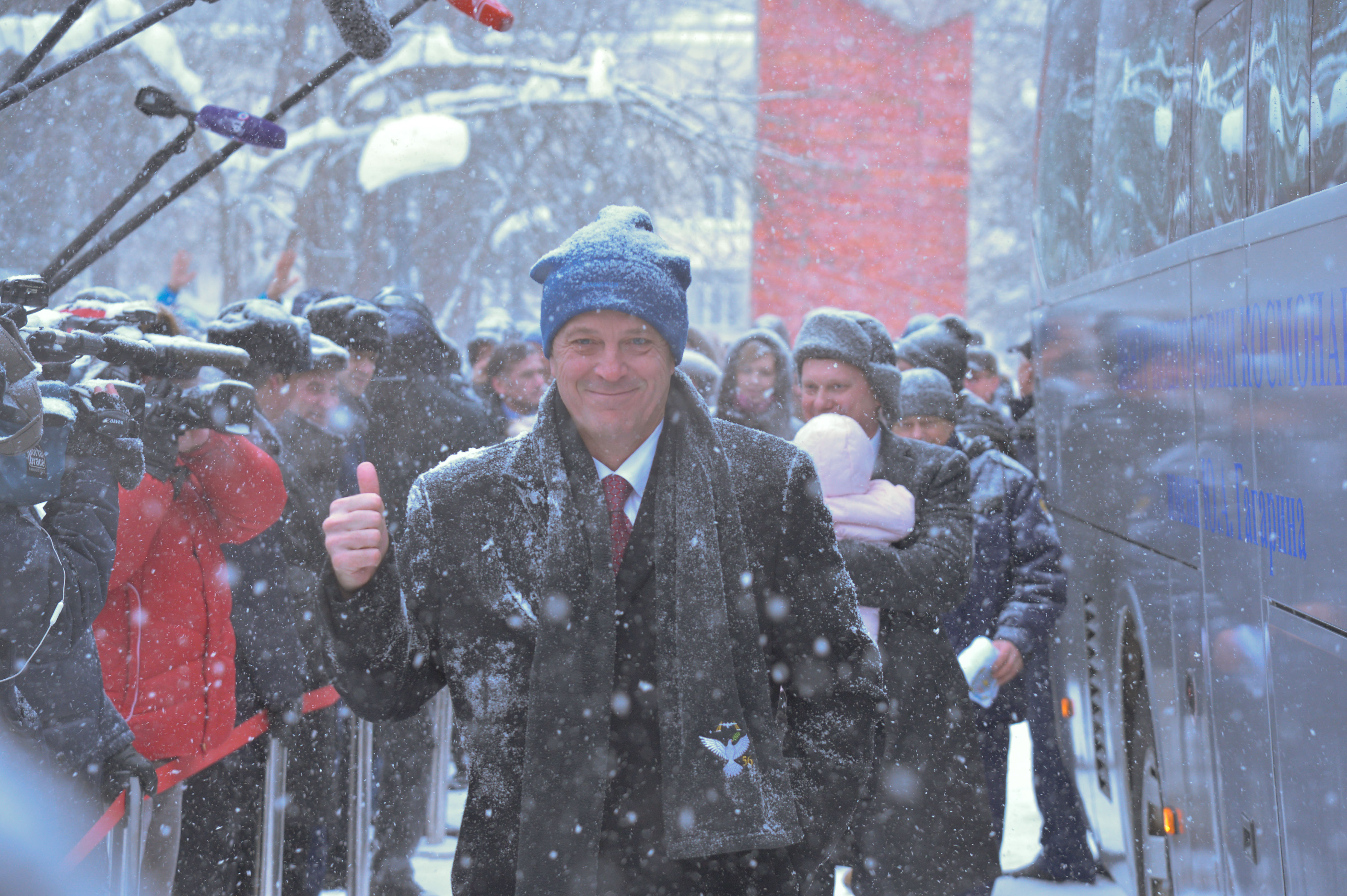 Bundled up against a blizzard, Expedition 55 crewmember Ricky Arnold of NASA flashes a thumbs up as he departs the Gagarin Cosmonaut Training Center in Star City, Russia March 4 for a flight to his launch site at the Baikonur Cosmodrome in Kazakhstan. Arnold, Oleg Artemyev of Roscosmos and Drew Feustel of NASA will launch March 21 on the Soyuz MS-08 spacecraft for a five month mission on the International Space Station.