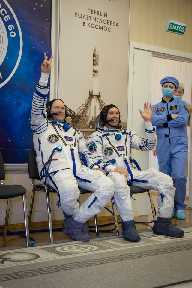 At the Baikonur Cosmodrome in Kazakhstan, Expedition 55 crewmembers Oleg Artemyev of Roscosmos (left) and Drew Feustel of NASA (right) wave to photographers March 5 during the crew’s first vehicle fit check activities. Along with Ricky Arnold of NASA, they will launch March 21 in the Soyuz MS-08 spacecraft from Baikonur for a five-month mission on the International Space Station.