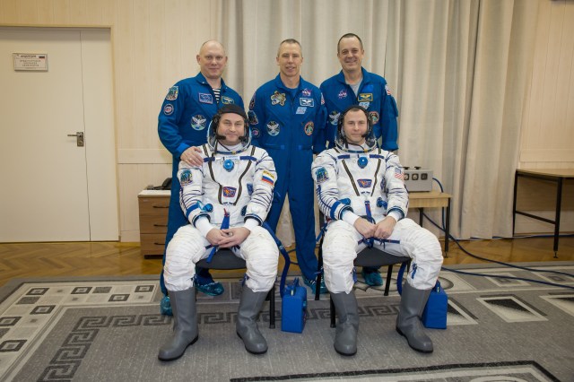 At the Baikonur Cosmodrome in Kazakhstan, the Expedition 55 backup and prime crewmembers pose for pictures March 5 as part of the crew’s first vehicle fit check activities. In the front row are the backup crewmembers, Alexey Ovchinin of Roscosmos (left) and Nick Hague of NASA (right). In the back row are the prime crewmembers, Oleg Artemyev of Roscosmos (left), Drew Feustel of NASA (center) and Ricky Arnold of NASA (right), who will launch March 21 in the Soyuz MS-08 spacecraft from Baikonur for a five-month mission on the International Space Station.